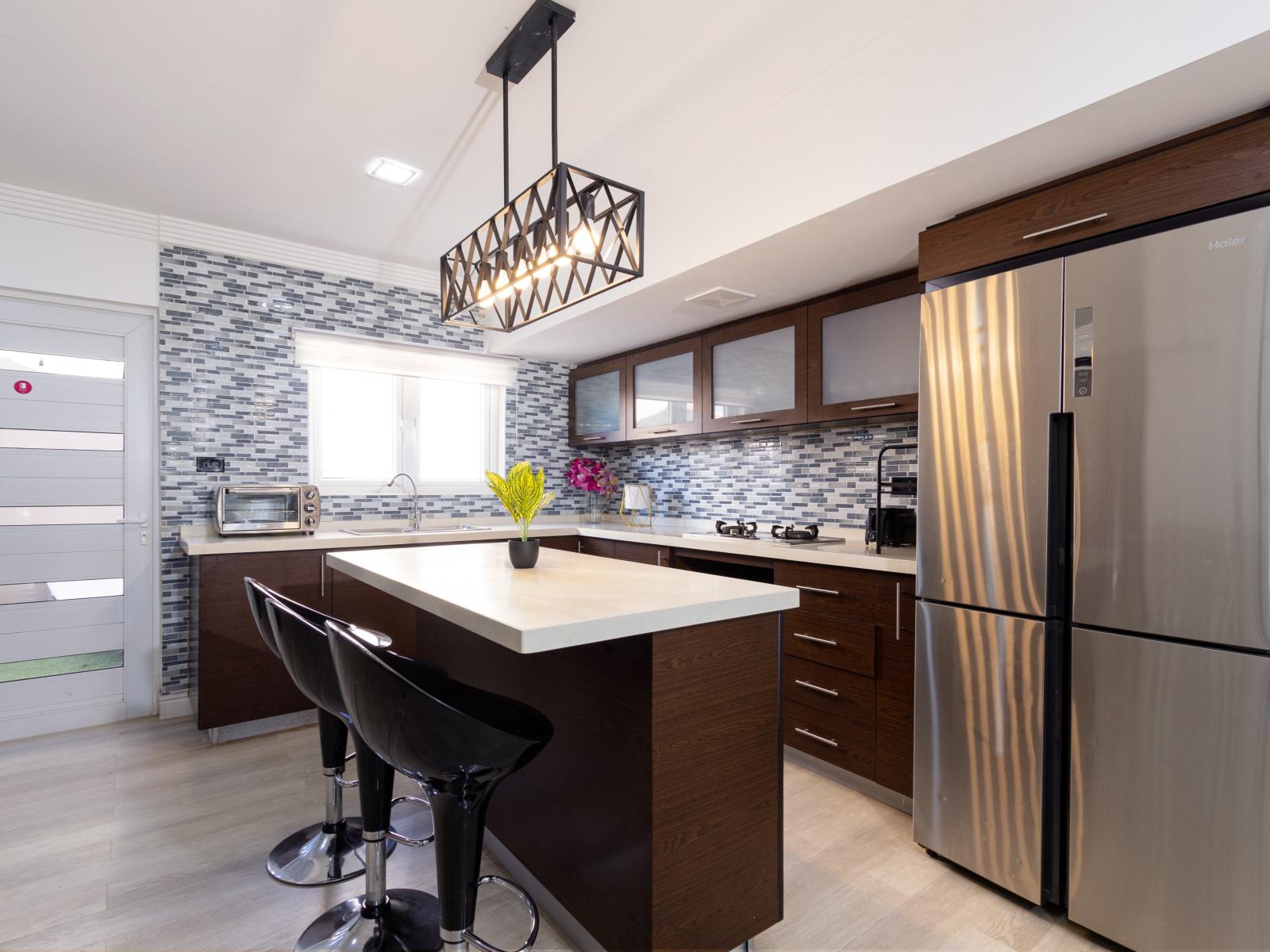 Modern Kitchen of the 3BR House in Oranjestad Aruba - Fully Equipped - Thoughtful placement of kitchen essentials for easy access - Meal Bar and High Chairs