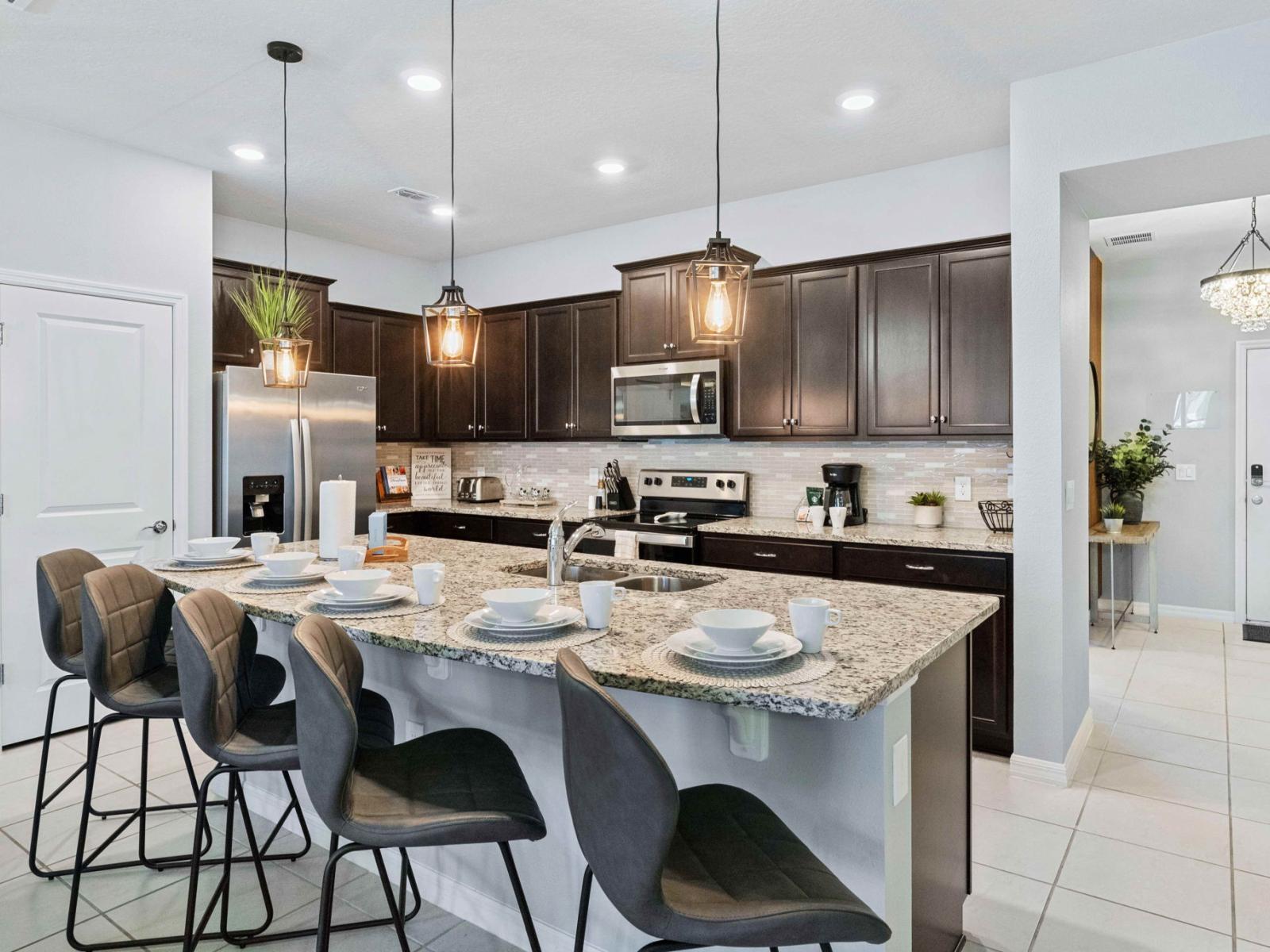 This fully equipped kitchen is a chef's dream, boasting modern appliances and ample space for culinary creations, where every meal becomes a masterpiece and every moment a delight.