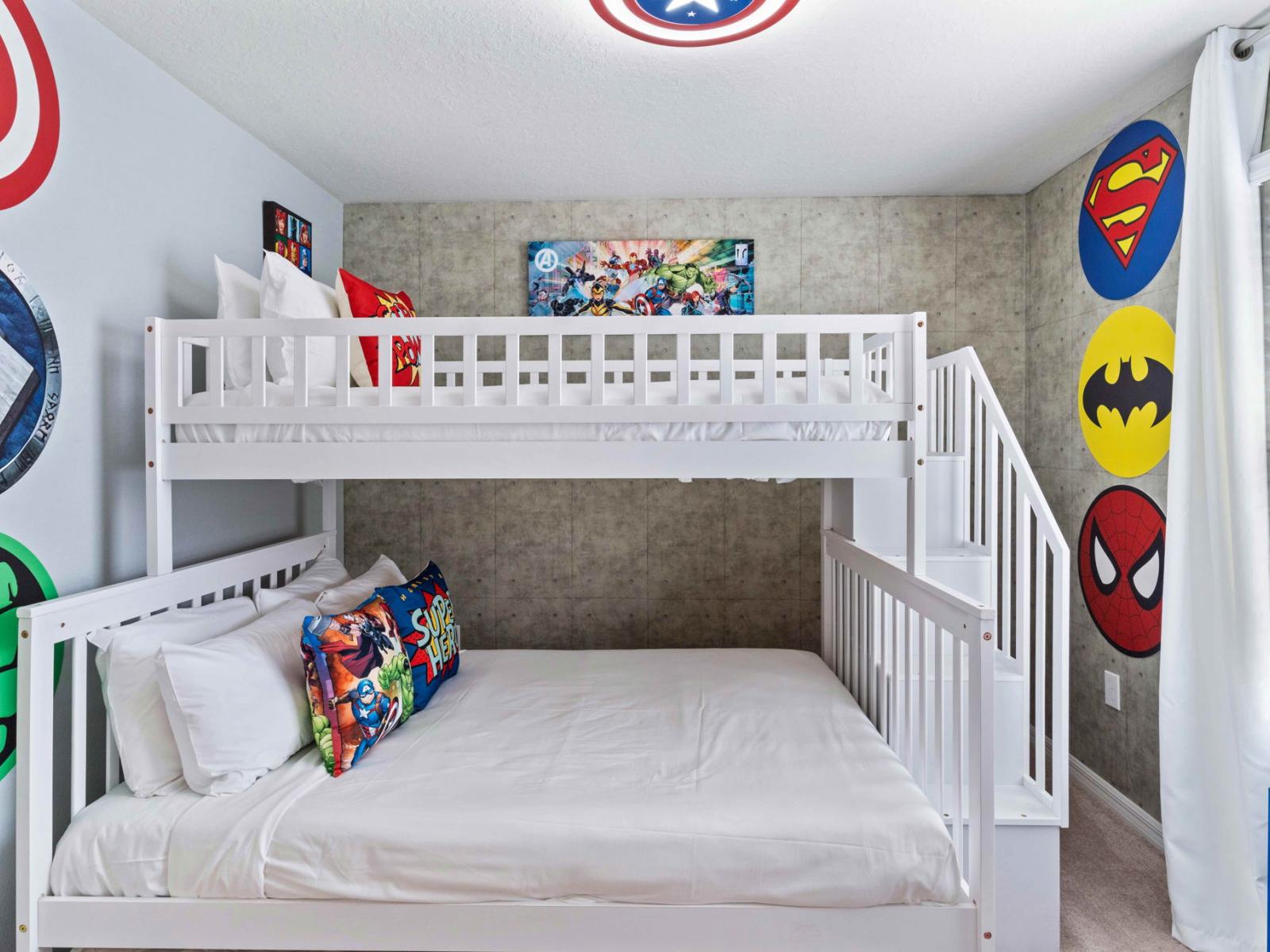 Bedroom 4 welcomes with a playful Super Hero accent wall and a bunk bed featuring both a single and double mattress. It's a vibrant haven where imagination runs wild and dreams of superhero escapades come to life.