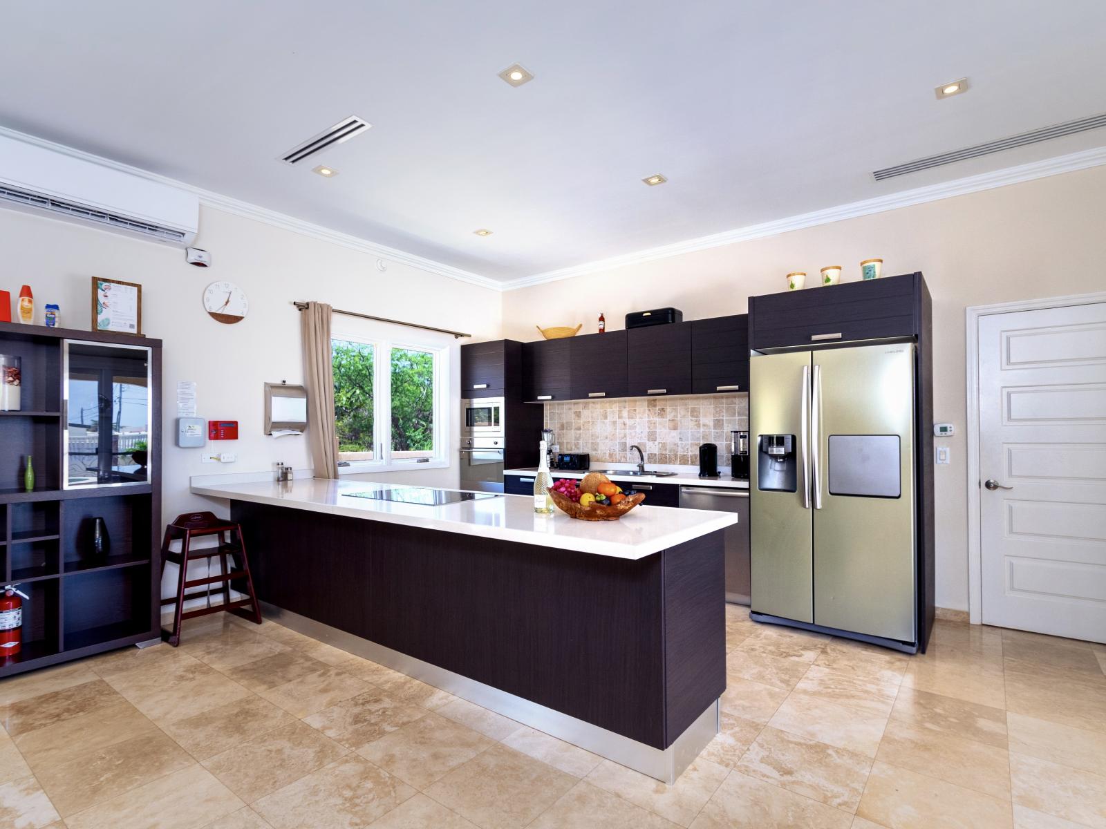 Fully equipped kitchen- everything you need is here! with a huge refrigerator to store more food, you can also cook your favorite dishes and meals for the people in the villa. Maximize your stay with serving full packed meals.