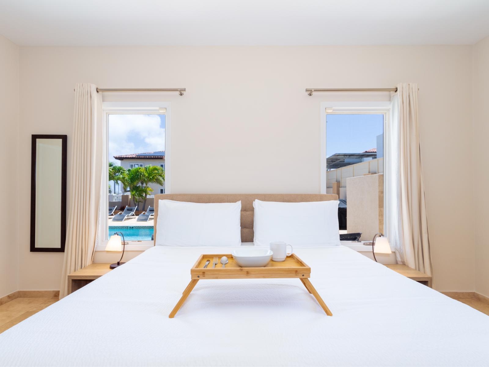 Poolside Serenity: Wake Up to Views of Paradise in Bedroom 3's King Size Comfort! 🛏️🏊‍♂️🌅