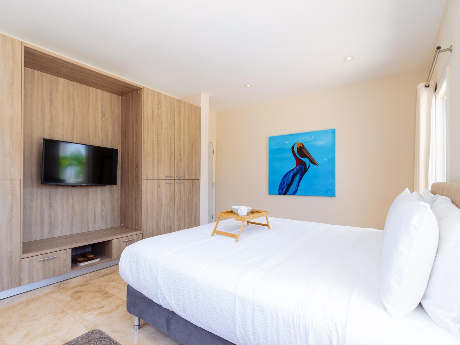 Entertainment Haven: Bedroom 3 Offers the Best of Both Worlds with a King Size Bed and a Wall-Mounted Flat Screen TV! 📺🛏️✨