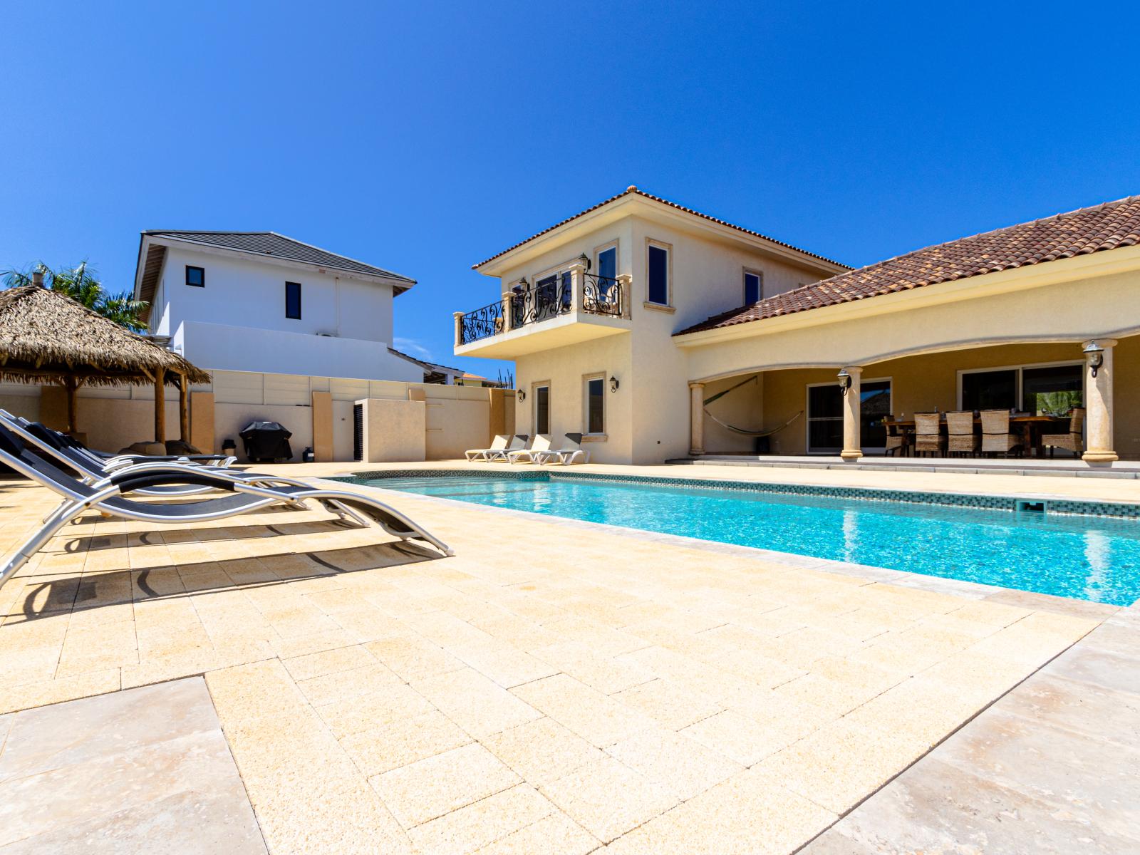 Sunny Siestas Await: Bask in Comfort with Ample Poolside Loungers for Your Ultimate Relaxation! ☀️🌴