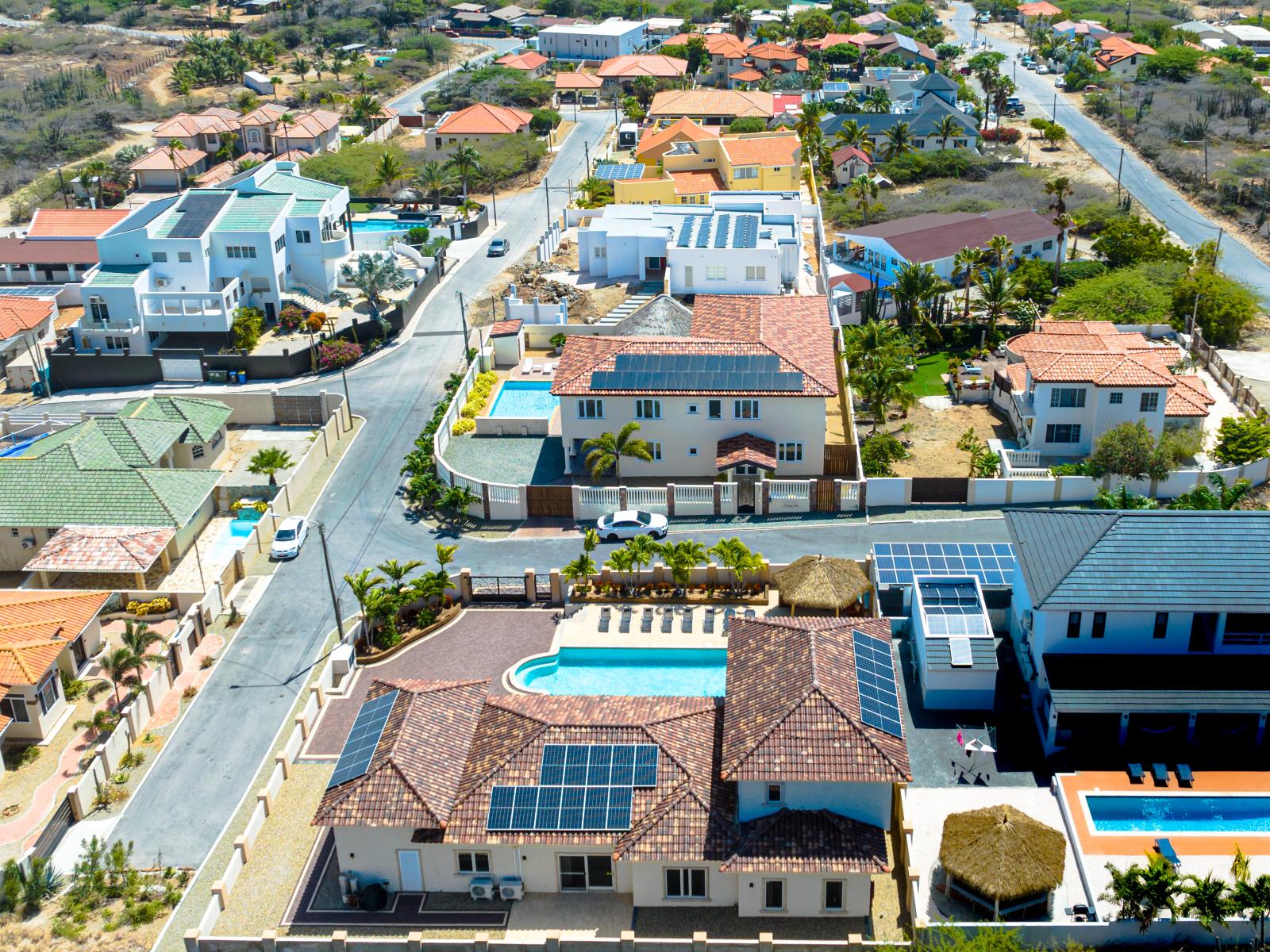 Elevate your senses: behold the beauty of our property from a bird's eye view, showcasing its tranquil surroundings and captivating allure.