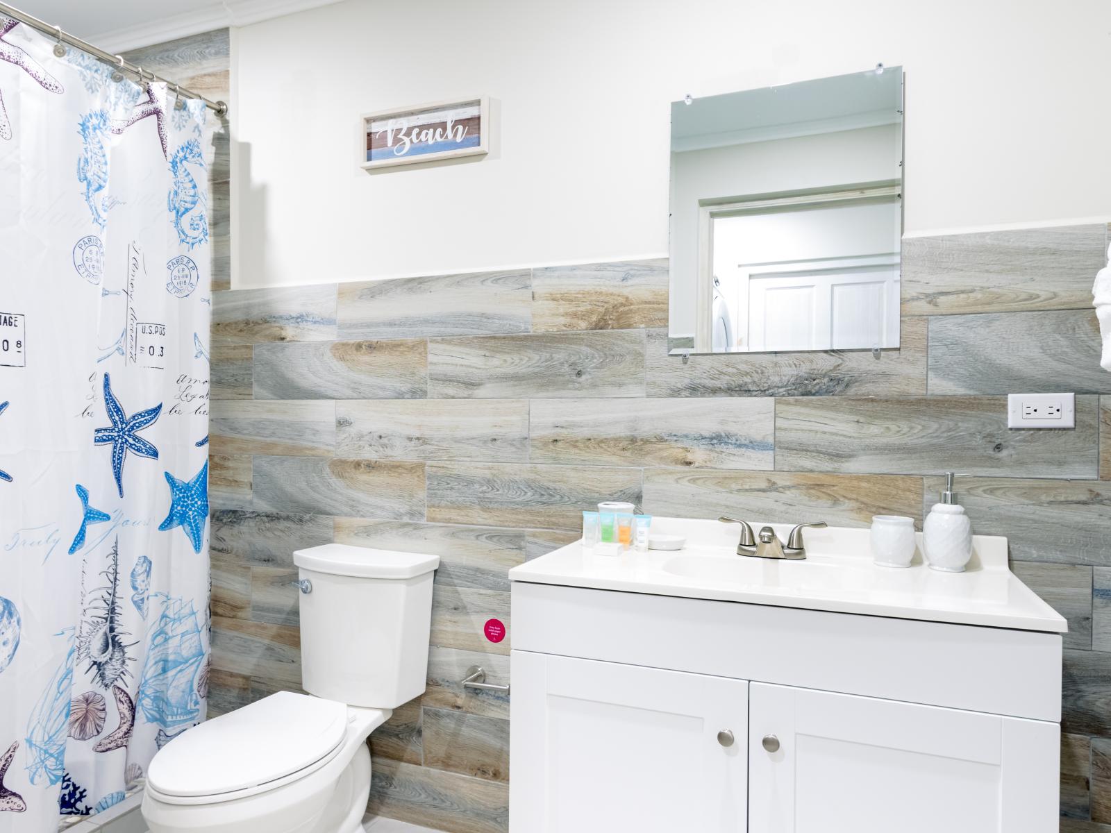 Impressive Bathroom of the 2-BR Condo in Noord Aruba - Contemporary fixtures for a touch of indulgence - Attention to detail, from the elegant tiles to the faucets - Inviting bathroom with a soothing color palette for a tranquil feel