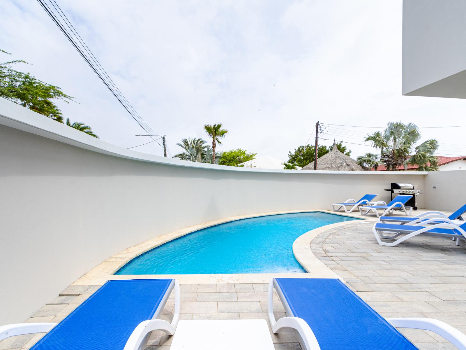 Our outdoor shared pool and hot tub offer a refreshing retreat for guests seeking relaxation and leisure.