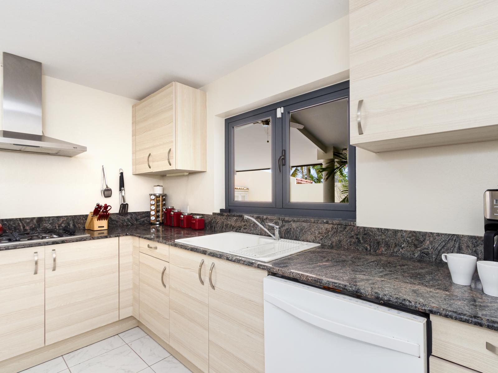 Opulent Kitchen of the Villa in Noord Aruba - Fully Equipped - Functional layout designed for efficient meal preparation - Smart use of space with versatile storage solutions