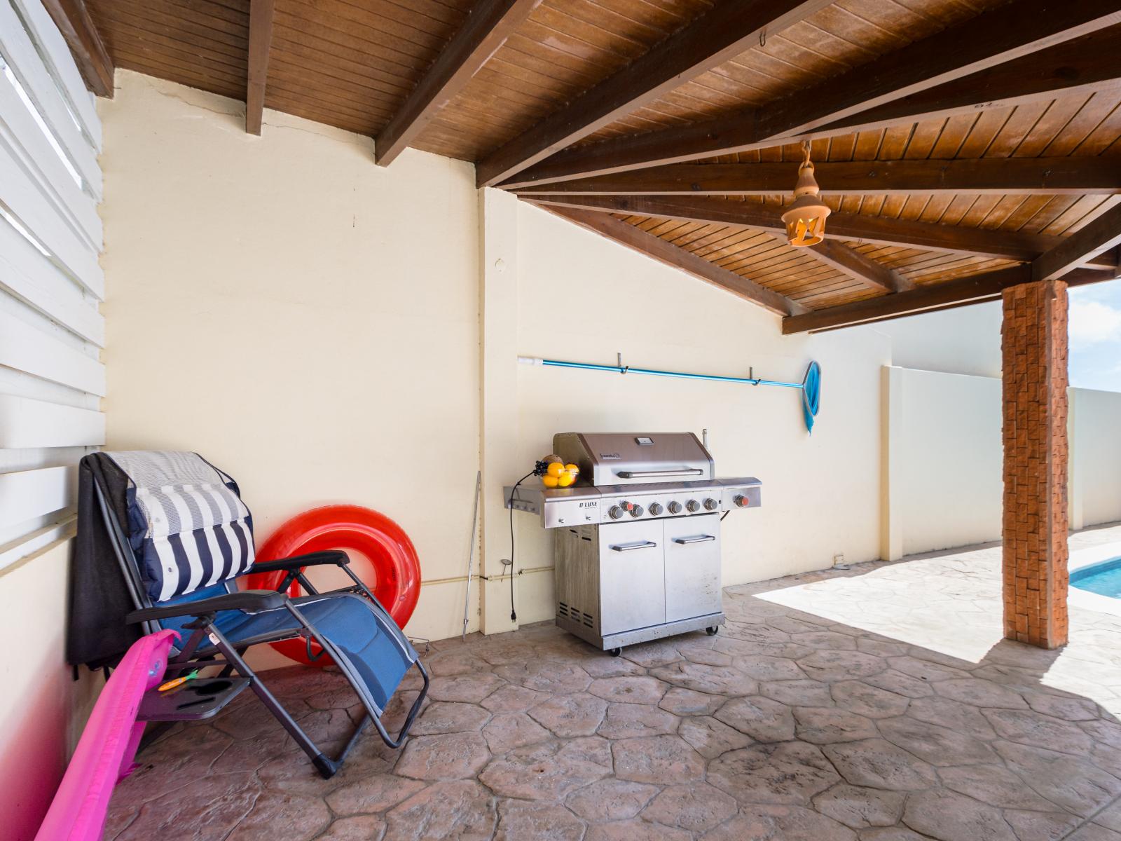 Gather with family and friends in our charming covered BBQ grill area, perfect for outdoor dining and entertaining. Enjoy delicious meals and create unforgettable memories in this cozy, shaded spot.