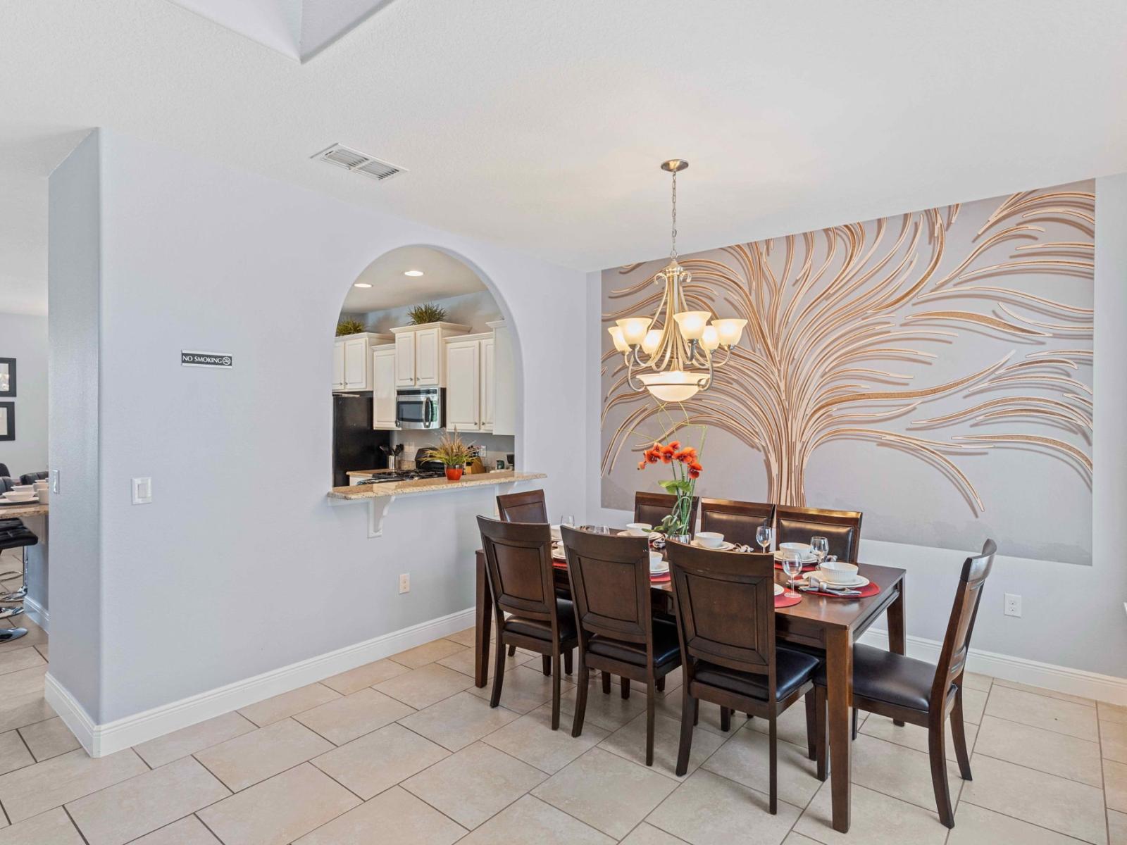 Elegant dining area of the home in Davenport Florida - 8 Persons dining - Chic dining area featuring a stylish table and contemporary seating - Harmonious color scheme for a cohesive and stylish look - Beautiful wall designed