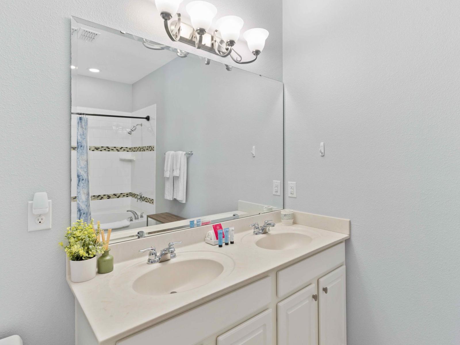 Bathroom 1 with a bathtub and a shower combo