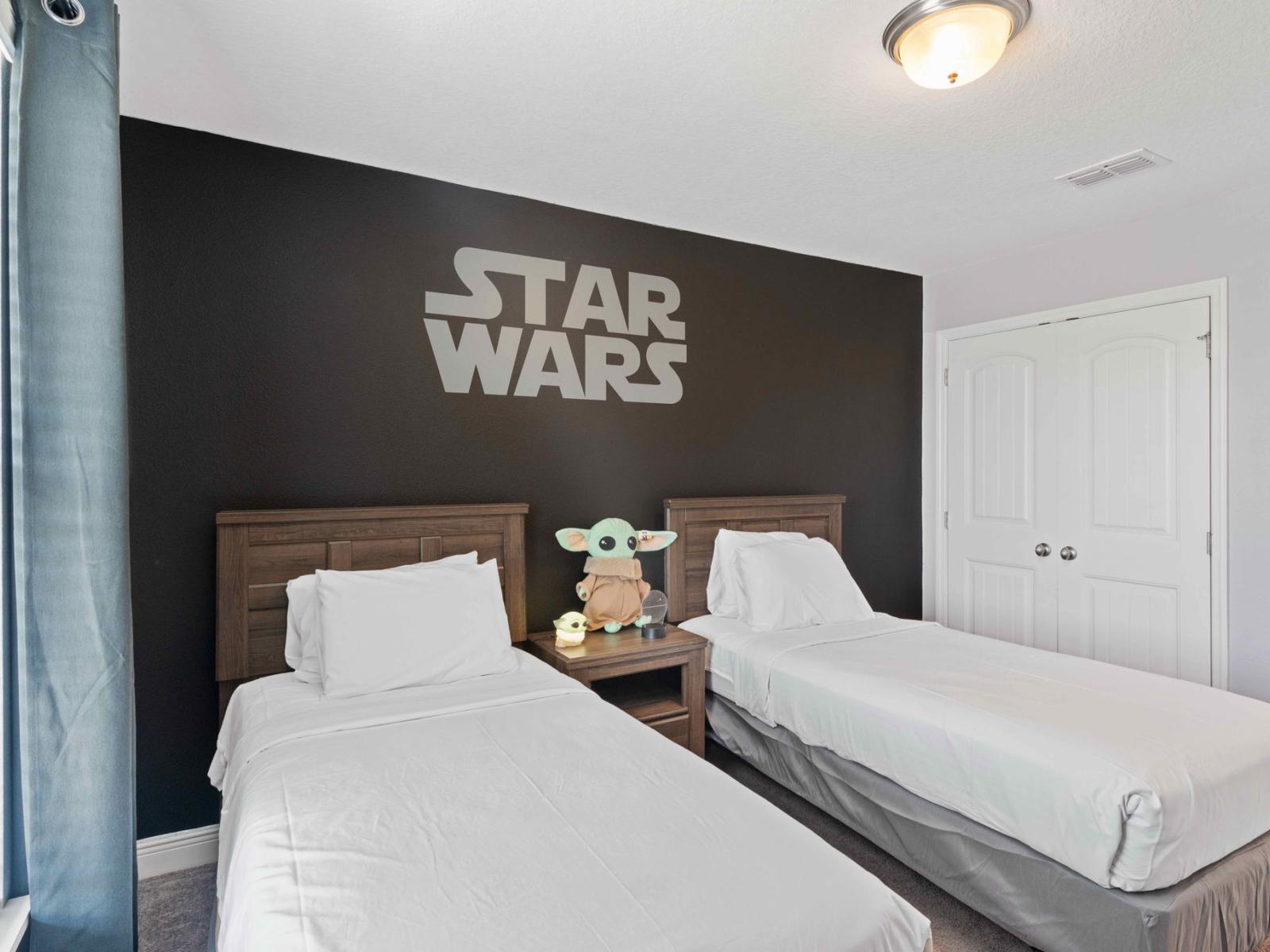 Star Wars-themed bedroom of the home in Davenport Florida - Featuring two single beds for restful night - A space designed for fans and enthusiasts - The force of comfort is strong