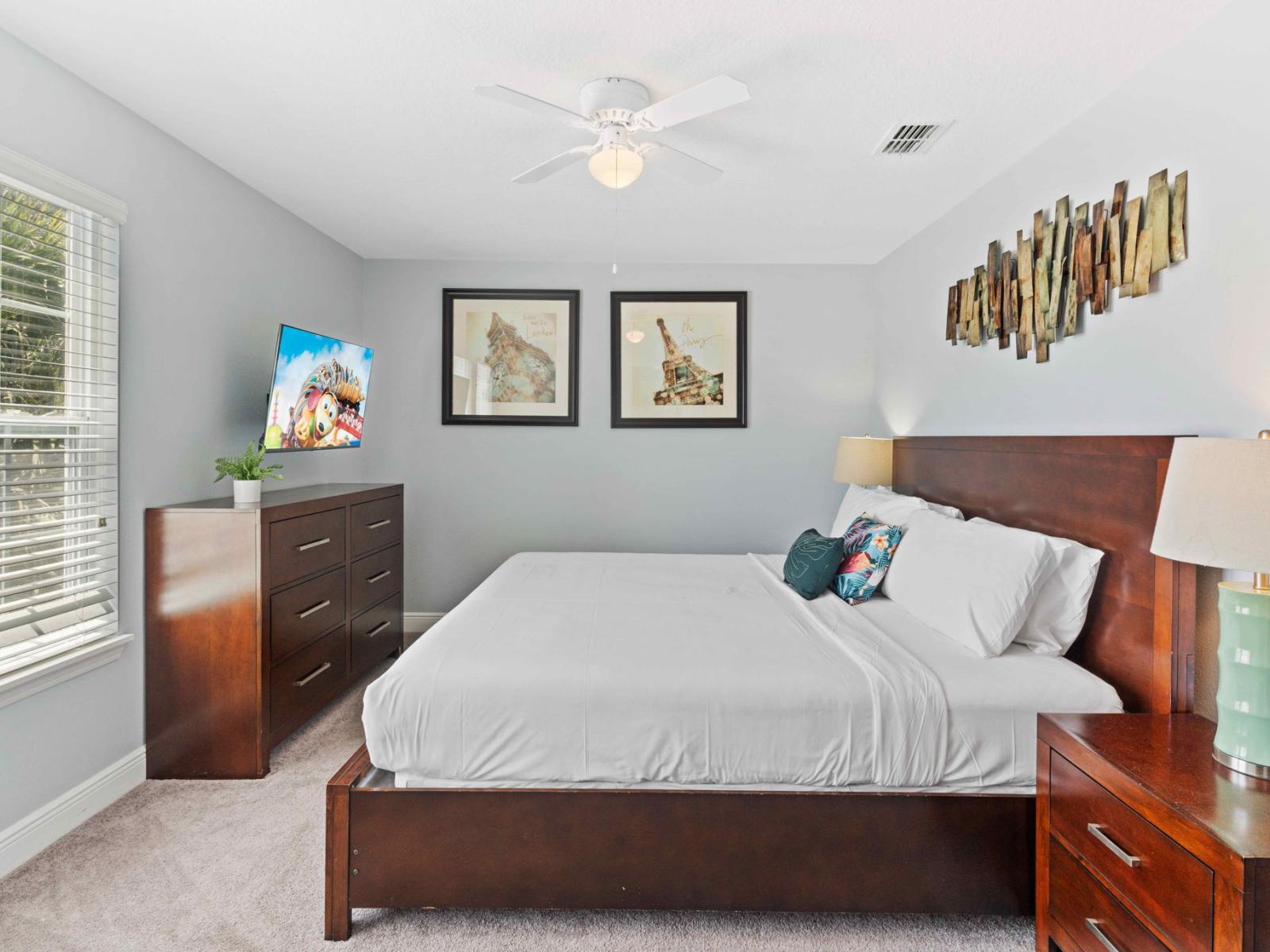 Tranquil bedroom of the home in Davenport Florida - Artistic touches with unique artwork and décor - Comfortable double bed for relaxing sleep - Harmonious color palette creating a soothing atmosphere - Smart TV and Netflix