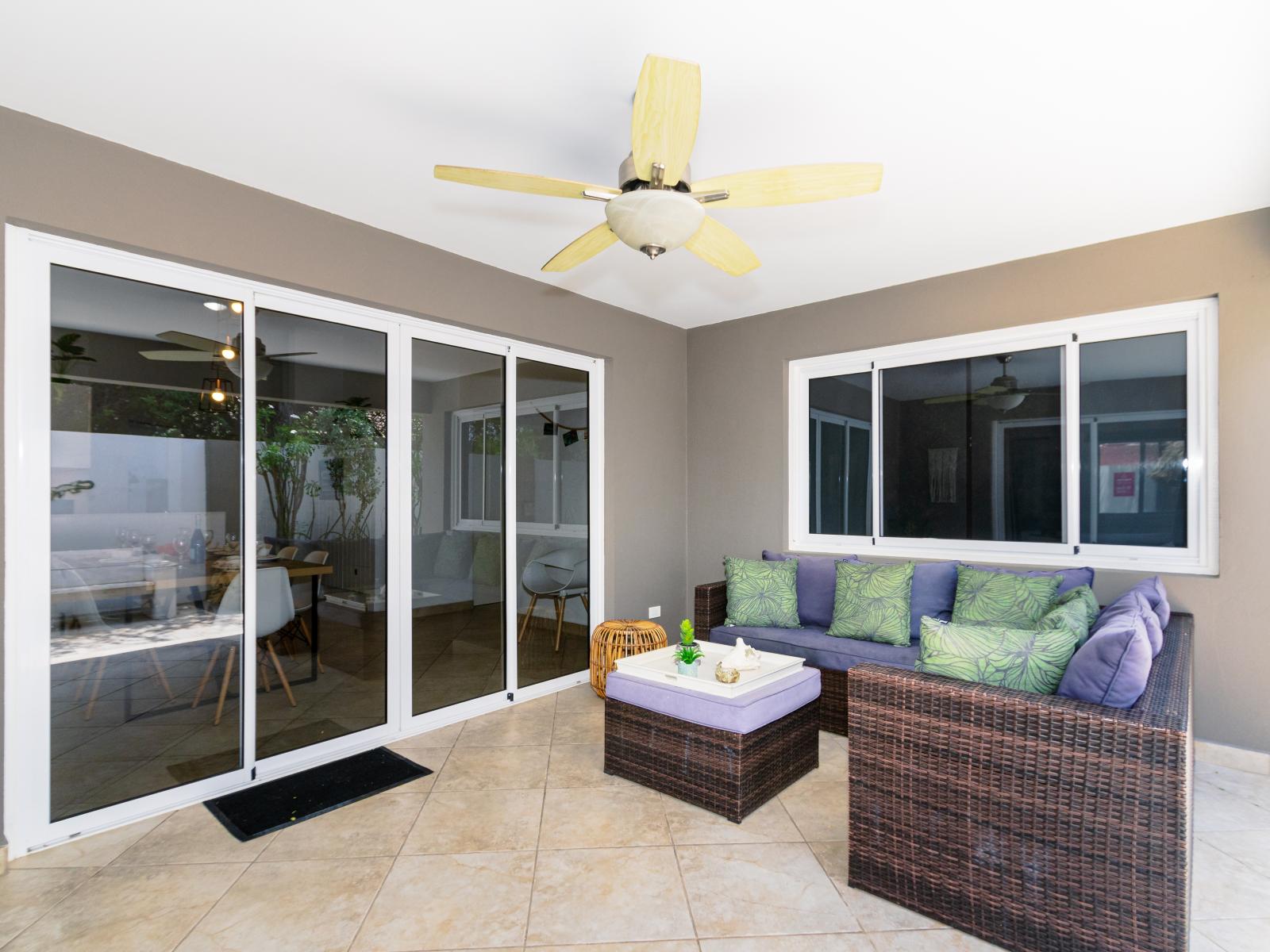 Represent Outdoor Seating Area of the 3BR house in Noord Aruba - Extends living space for outdoor enjoyment - Cozy seating area conducive to relaxation and socializing - Shaded seating for sensitive guests