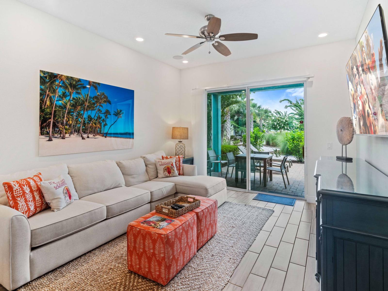 Splendid living area of the townhouse in Reunion Florida - Smart TV and Netflix - Plush sofas for relaxation - Stylish furniture arrangement providing comfort and a cohesive look - Easy access outdoors with seating