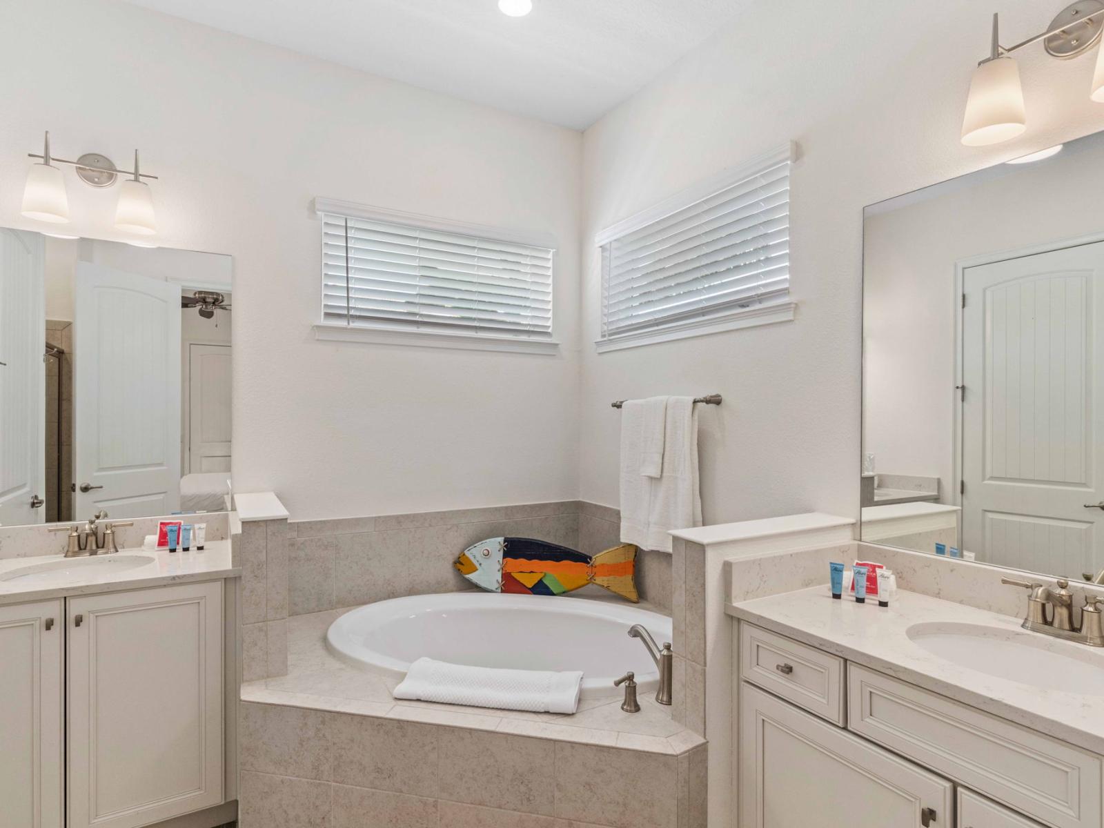 Bathing Bliss: Immerse yourself in elegance with our ensuite bathroom, featuring a decadent bathtub and a modern walk-in shower – the epitome of relaxation.