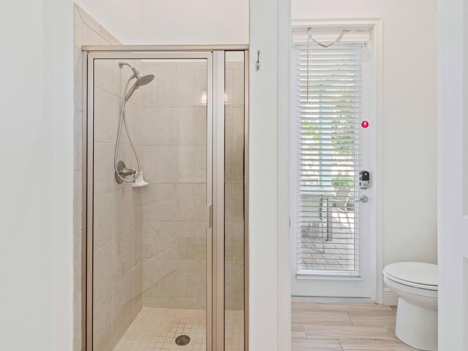 Stylish Shower Escape: Unwind in style in our bathroom, where a chic walk-in shower invites you to relax and rejuvenate in a serene setting.