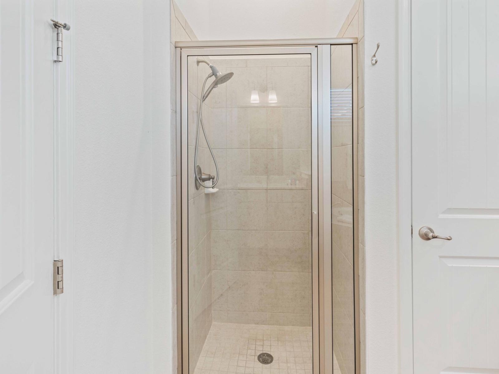 Stylish Shower Escape: Unwind in style in our bathroom, where a chic walk-in shower invites you to relax and rejuvenate in a serene setting.