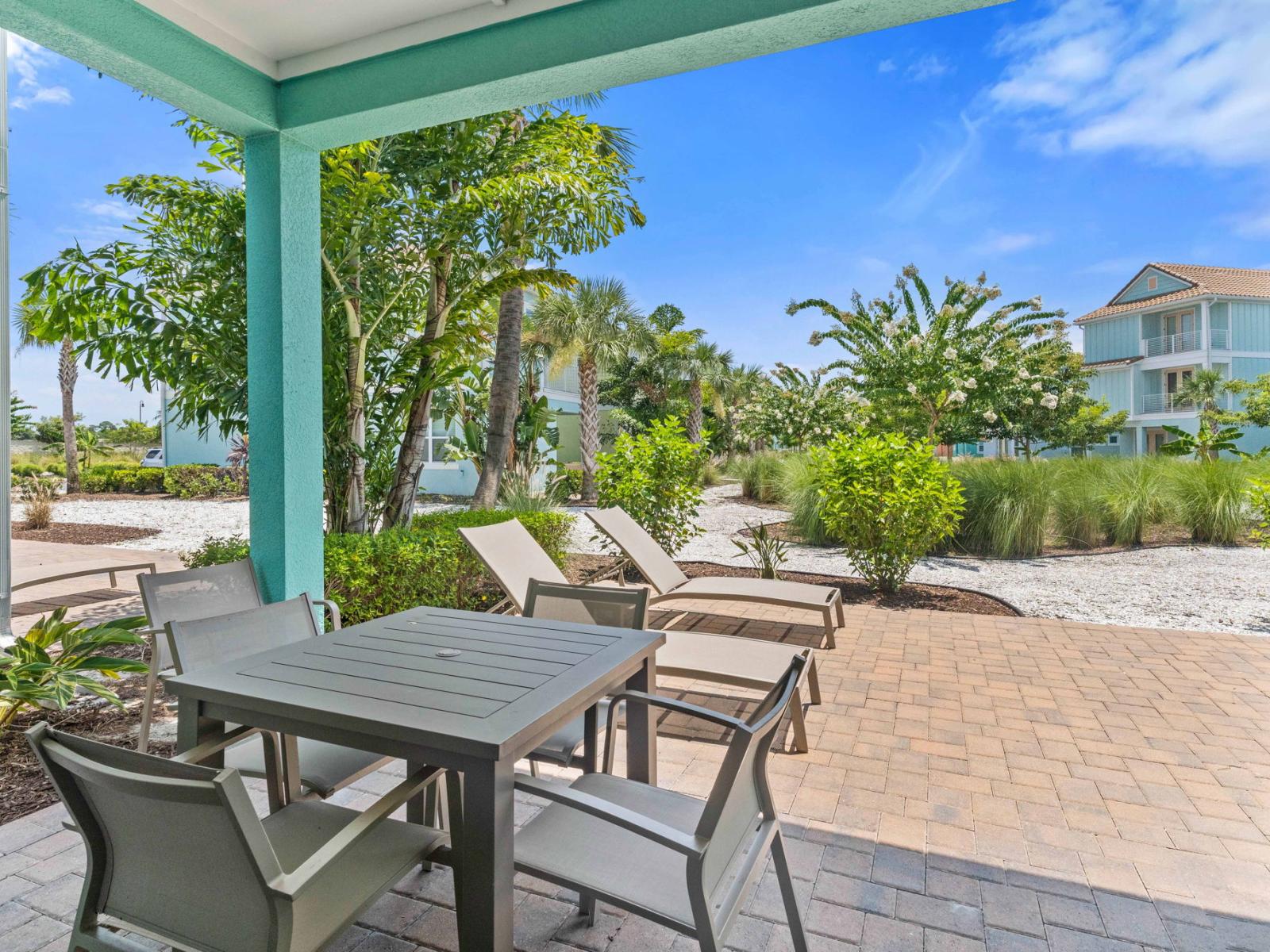 Refreshing outdoor dining area of the townhouse in Reunion Florida - Savor the flavors of paradise with a side of poolside serenity - Outdoor dining experience offers a feast for the senses - Every meal accompanied by stunning pool views