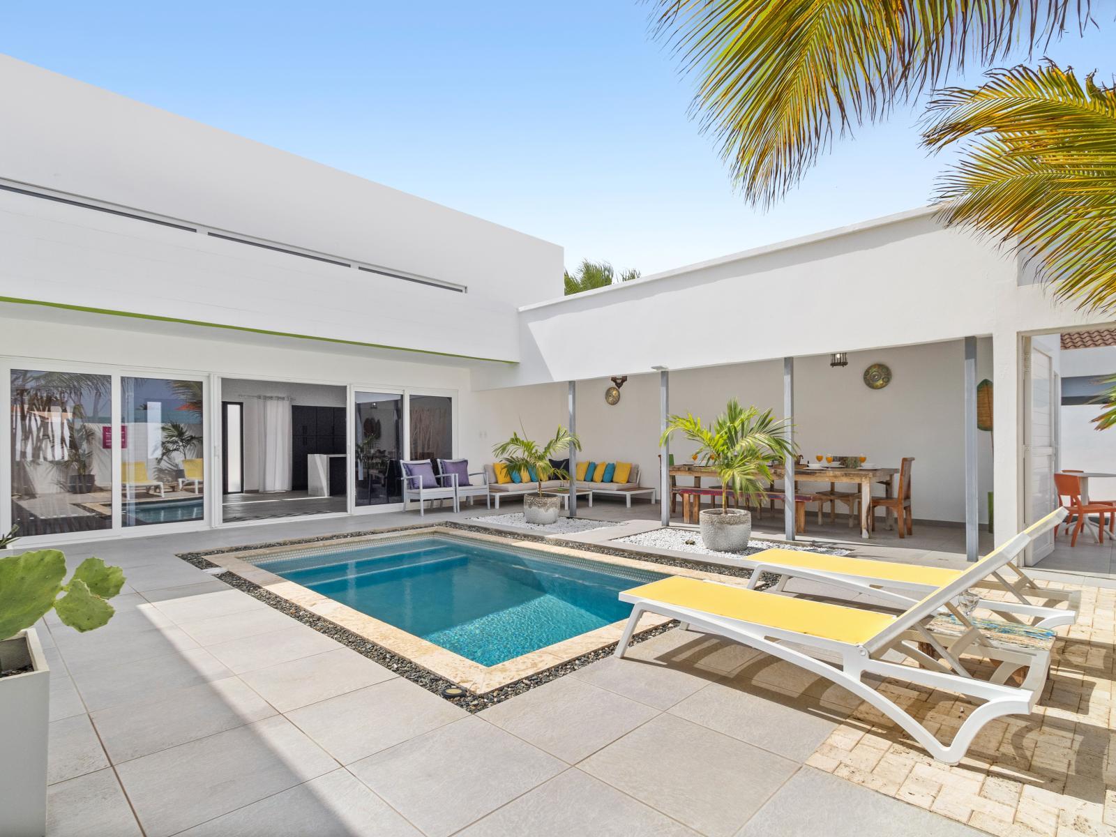 Lush Pool Area of the home in Noord Aruba - Discover serenity in our secluded tropical pool - Dive into tranquility amidst lush greenery and soothing waters - Discover a peaceful retreat in inviting pool