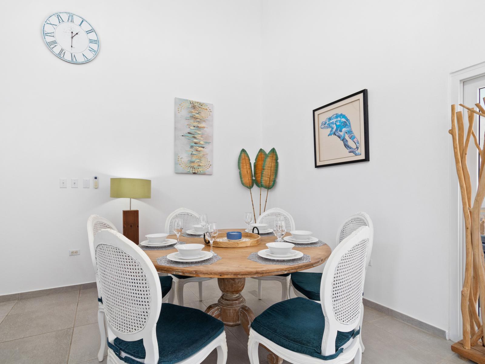 Eclat Dining Area of the home in Noord Aruba - Gather 'round and savor the moments - Dining table for six is the perfect setting for shared meals and cherished conversations - Sophisticated design with a blend of modern and classic elements