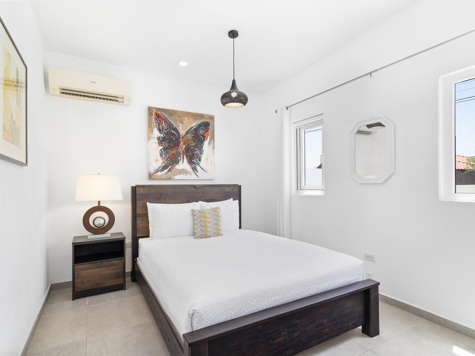 Deluxe Bedroom of the home in Noord Aruba - Comfy queen size bed - Artfully arranged decor elements, from wall art to decorative accessories - Stunning Outside Views