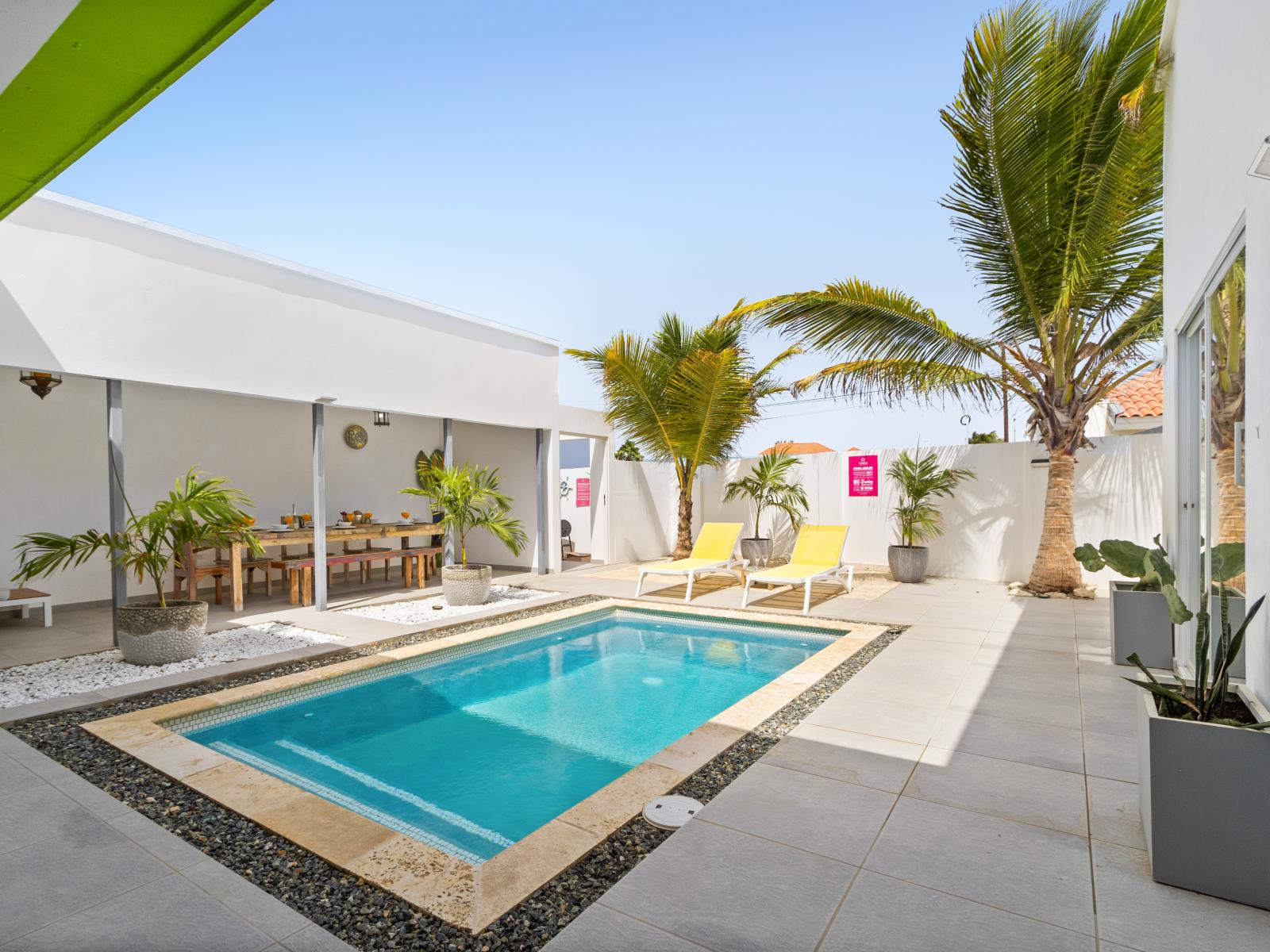 Inviting Pool Area of the home in Noord Aruba - Escape to tranquility in our secluded tropical pool oasis - Lush greenery and sparkling waters create a serene retreat