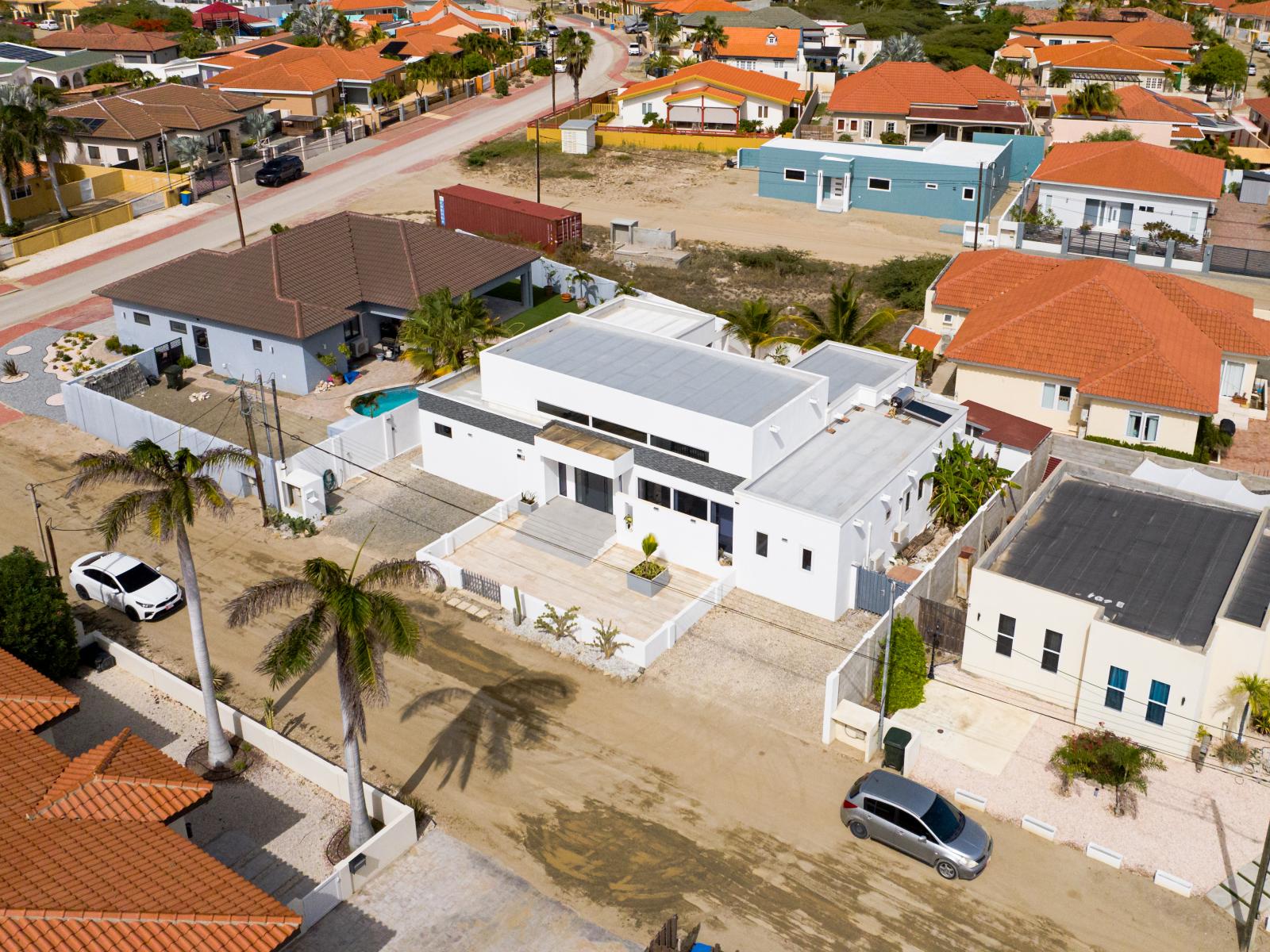 Elegant Outdoor Dining Area of the home in Noord Aruba - Savor the flavors of paradise with a side of poolside serenity - Outdoor dining experience offers a feast for the senses - Every meal accompanied by stunning pool views