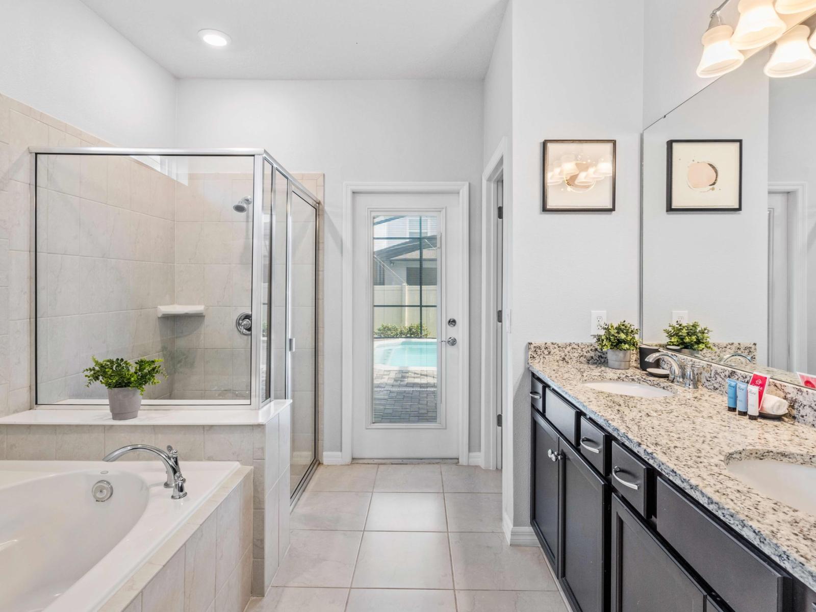 Bathroom 2 offers a luxurious escape with both a bathtub and walk-in shower. A serene oasis where indulgence meets convenience, promising moments of relaxation and rejuvenation in style.