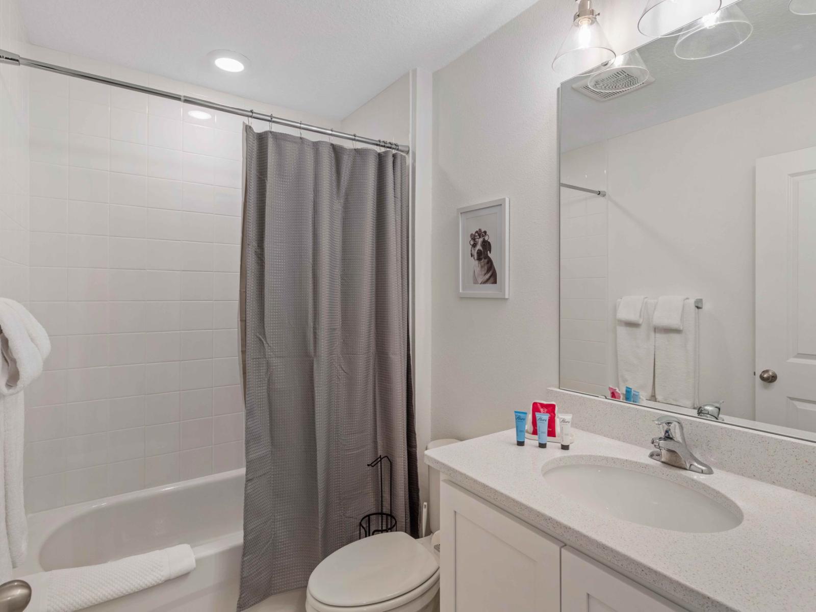 Relax and Refresh: Bathroom 2 Features a Convenient Bathtub and Shower Combination for Your Comfort.