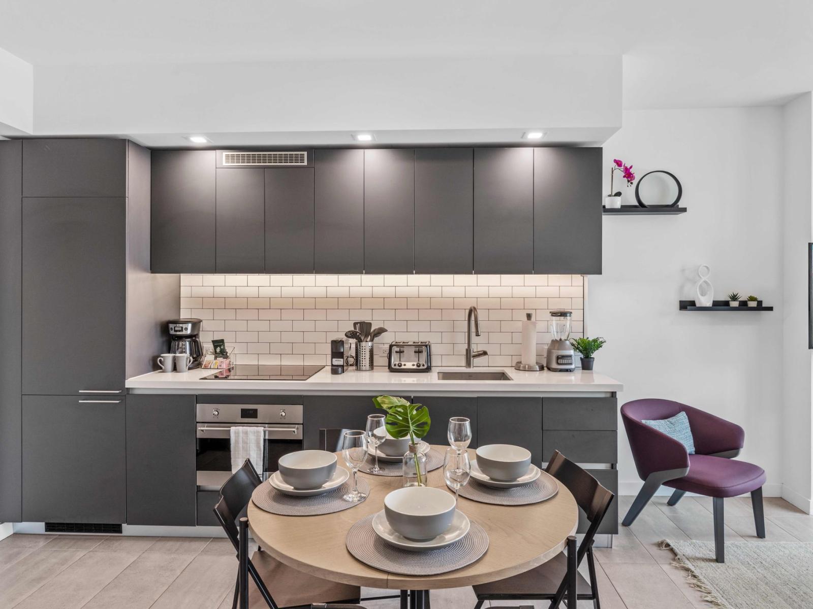 Sleek and Stylish Culinary Hub: Discover the joy of cooking in our sleek kitchen, where modern design meets functionality for a stylish culinary experience.