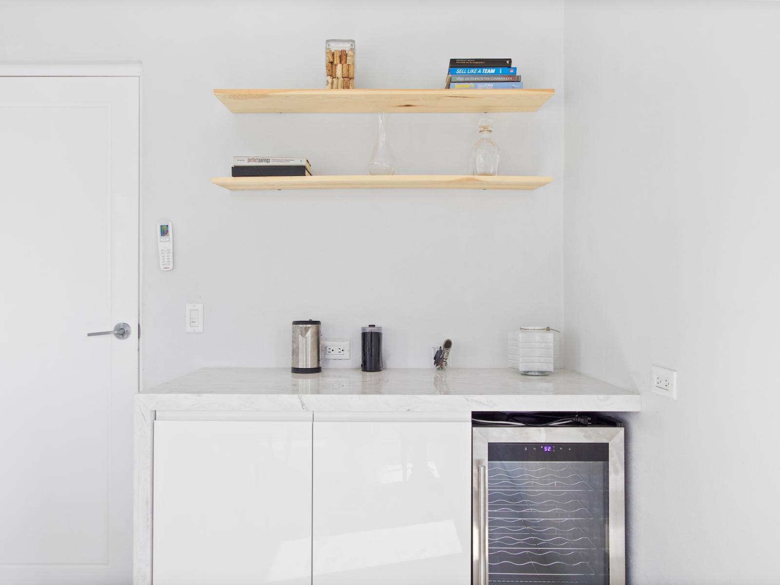 A stylish wine fridge - Custom-built shelving ensures functionality and a clutter-free environment - Chic and contemporary design with clean lines and modern furnishings