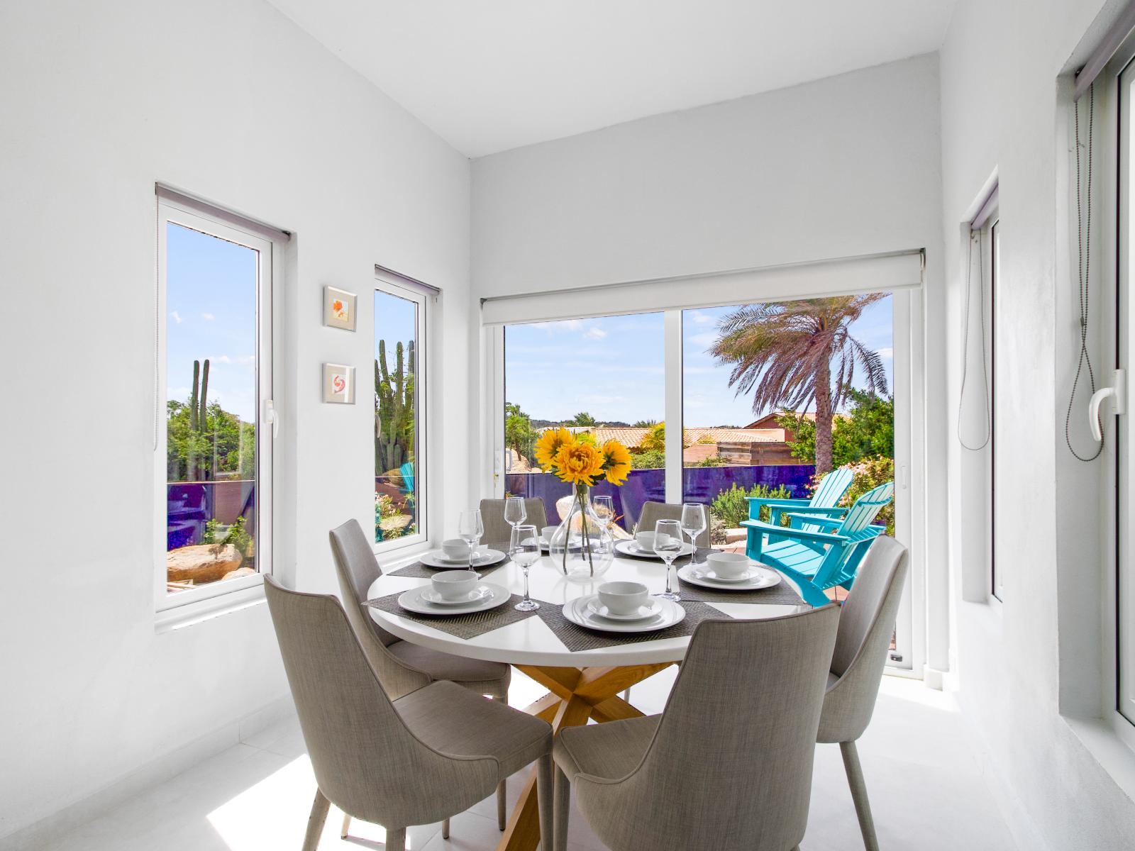 Plush Dining Area of the vacation home in Aruba - A dining table for six - Perfect ambiance for memorable meals - Bright and airy bedroom with large windows for natural illumination