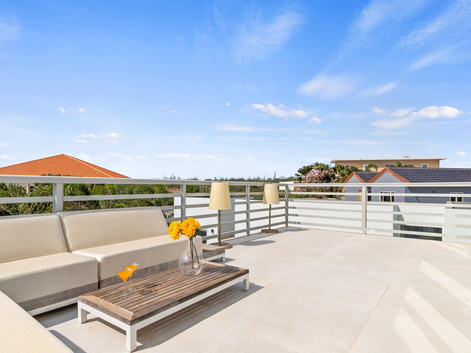 Amazing Private Balcony of the vacation home in Aruba - Chic coffee table perfect for starting your mornings with a wonderful view - Panoramic Views of the surrounding areas - Refreshing atmosphere