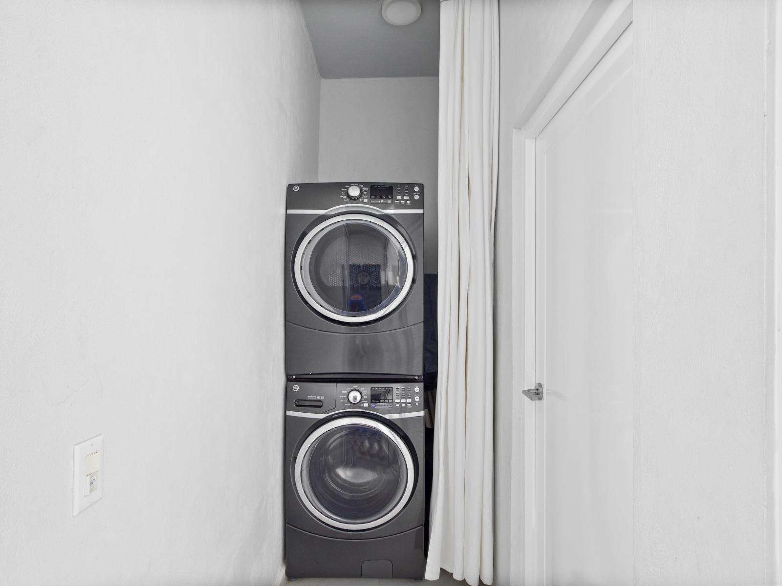 Take advantage of the washer and dryer unit, neatly tucked away for your laundry needs. This convenient feature allows you to do laundry at your own pace, ensuring you always have fresh clothes ready to go, enhancing the comfort and ease of your stay.