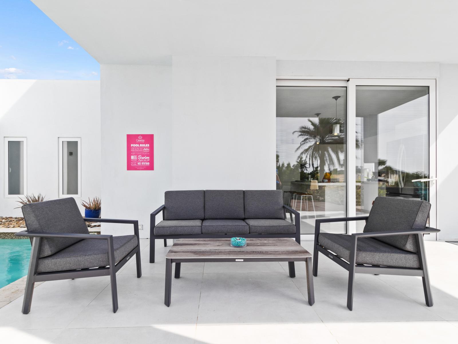 Comfy lounge chairs and a chic coffee table, a perfect setting to unwind_