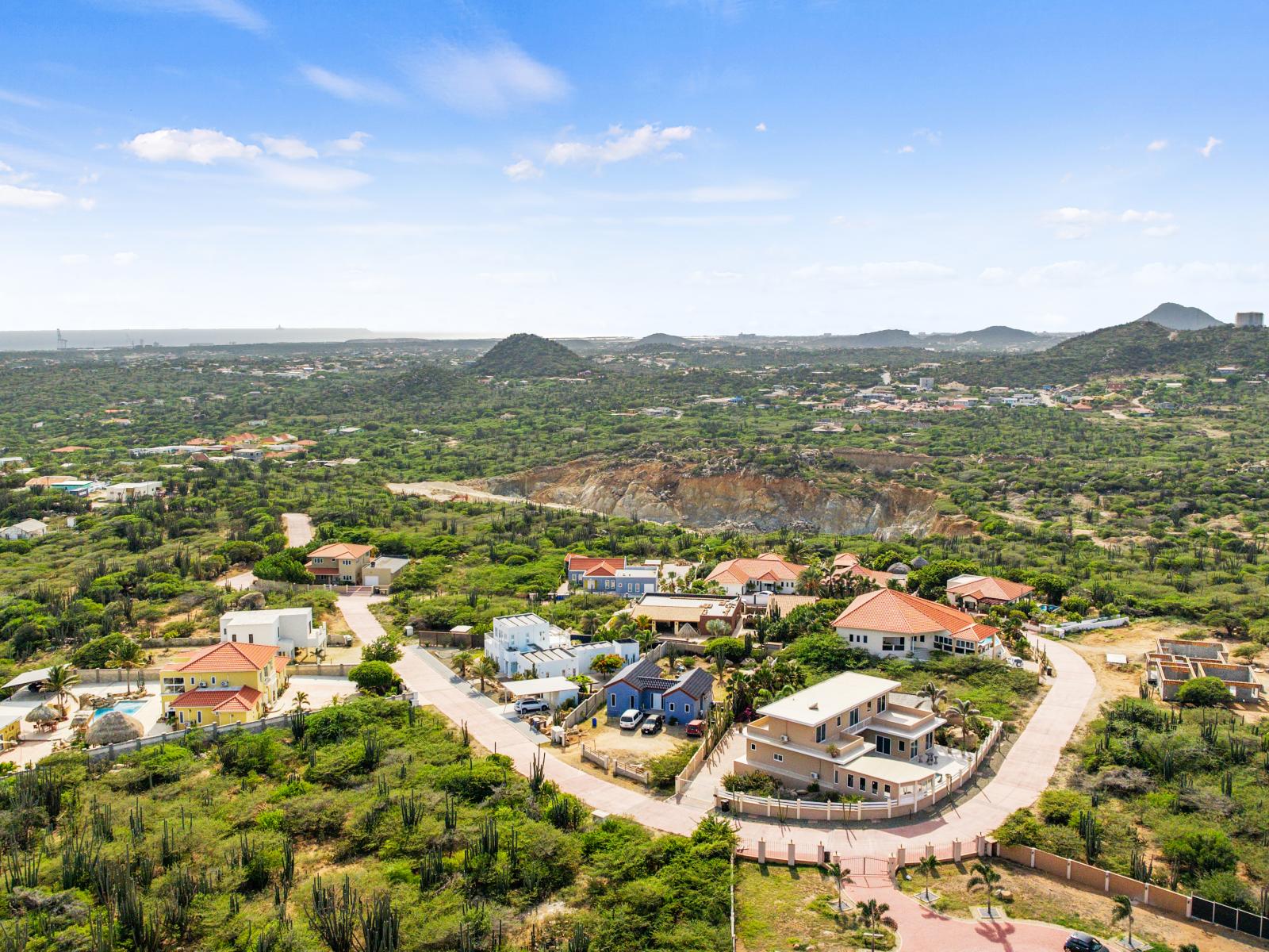 Aerial view of San Fuego - A breathtaking drone capture showcasing the entire San Fuego neighborhood, enveloped in the splendor of natural beauty.