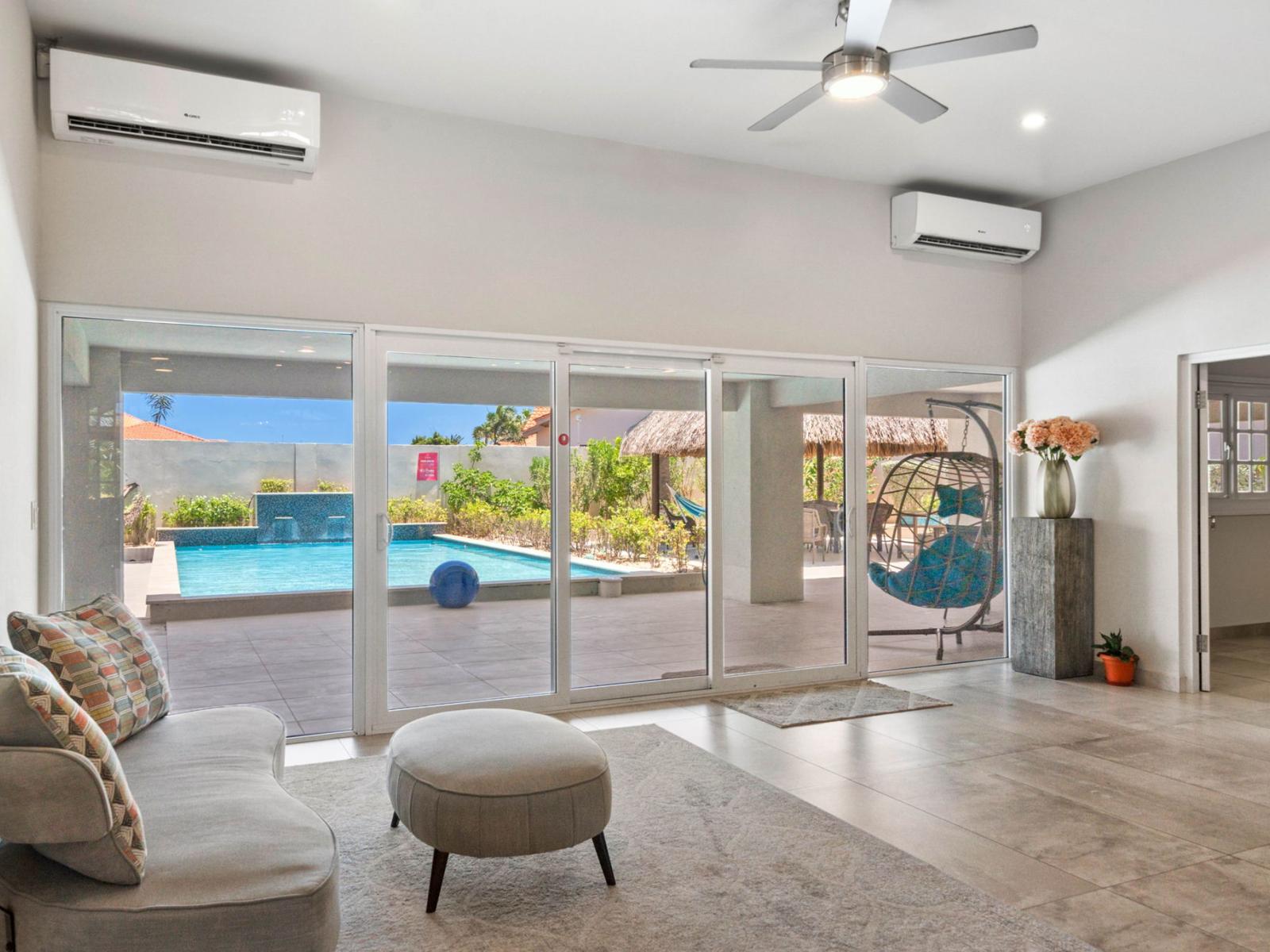 Cozy seating area with glass sliding door to the backyard.