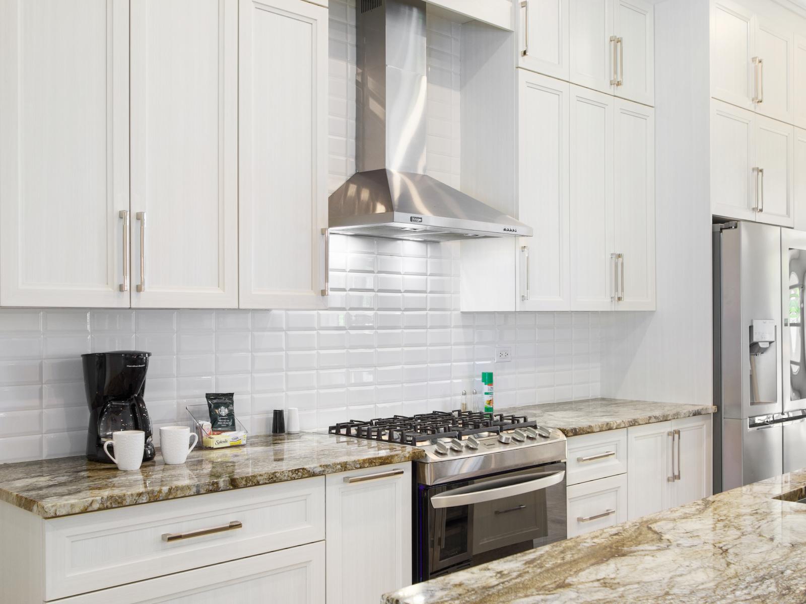 Luxurious kitchen with stainless steel appliances for a modern and elegant touch.