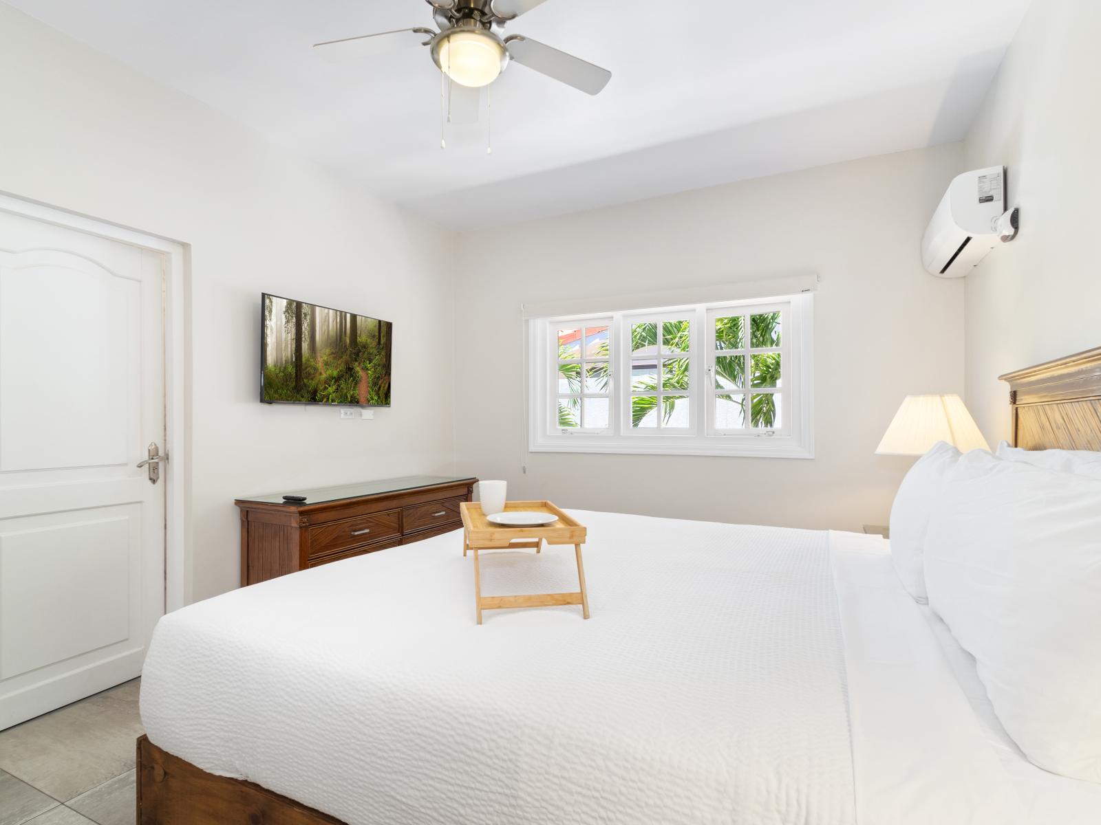 Luxury awaits: the third bedroom offers a spacious king bed and ensuite bathroom for a restful retreat.