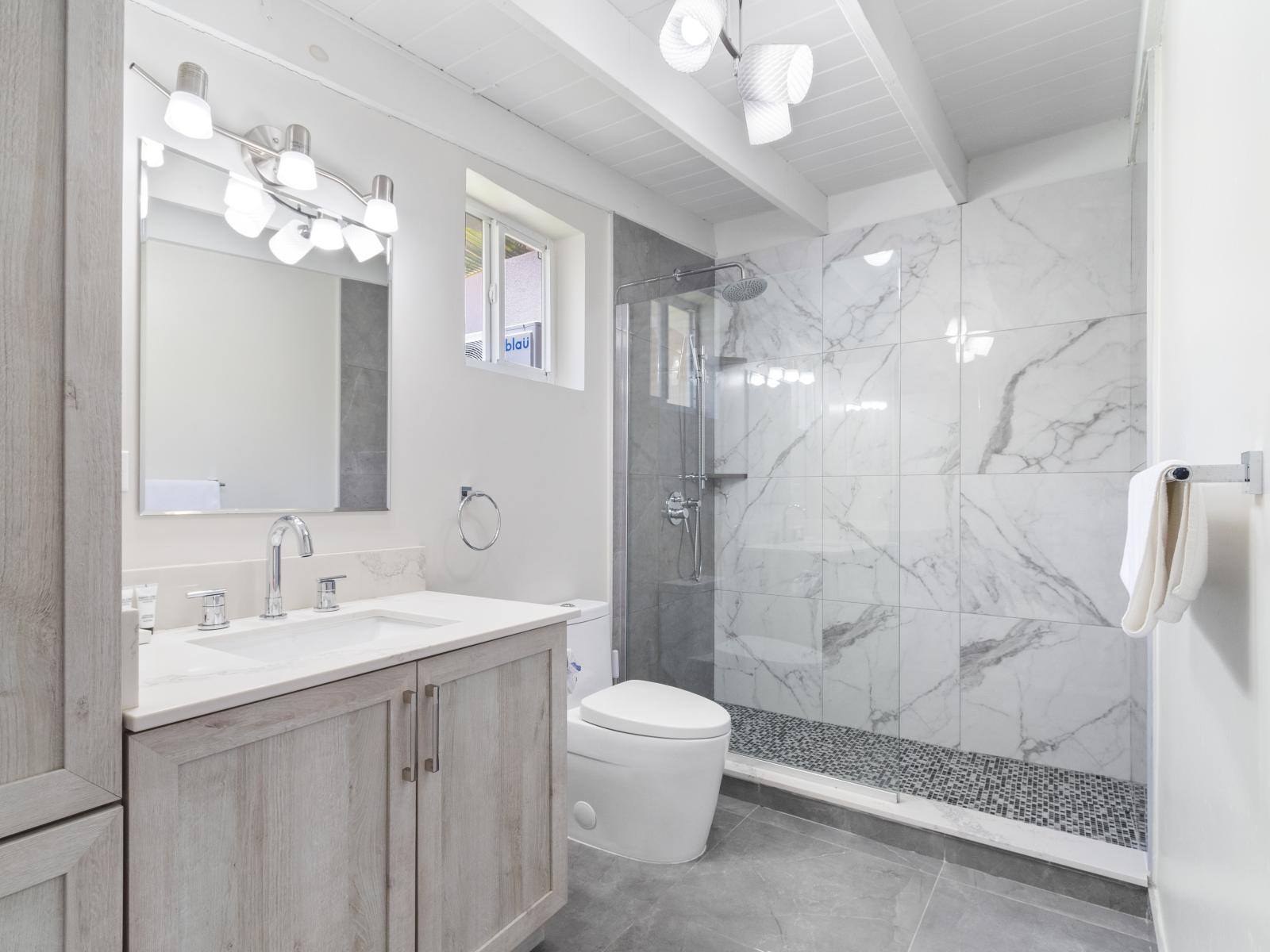 Luxuriate in comfort: the ensuite bathroom of the Master's bedroom provides a stylish walk-in shower, perfect for unwinding after a long day.