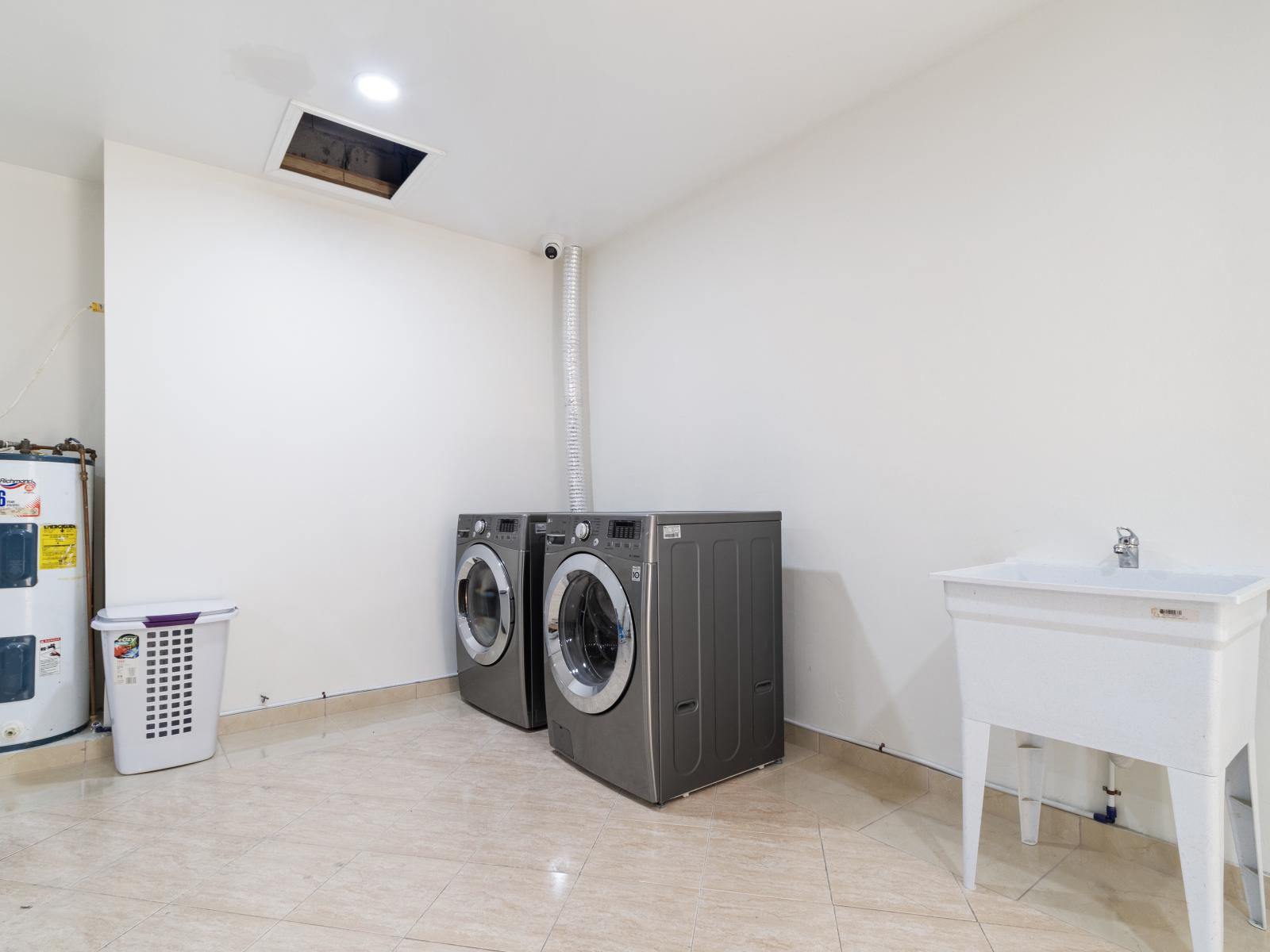 Garage Laundry Room with washer and dryer