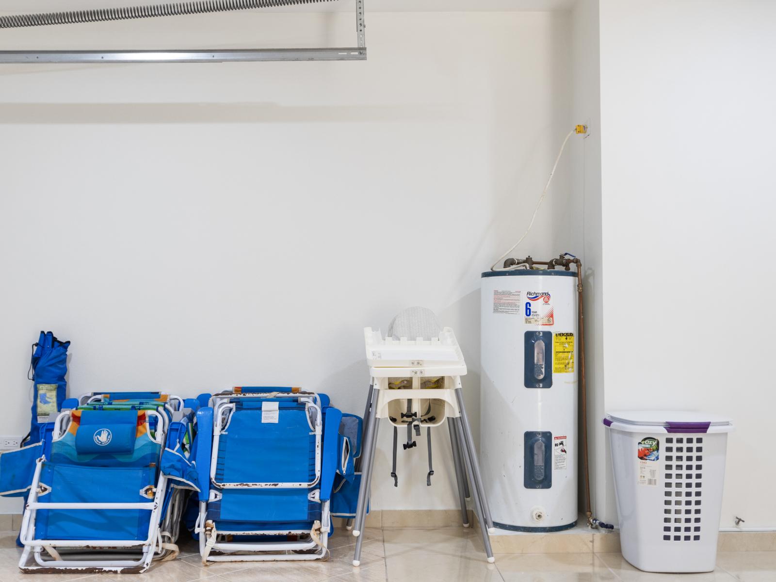 Garage Laundry room with beach chairs and baby chair