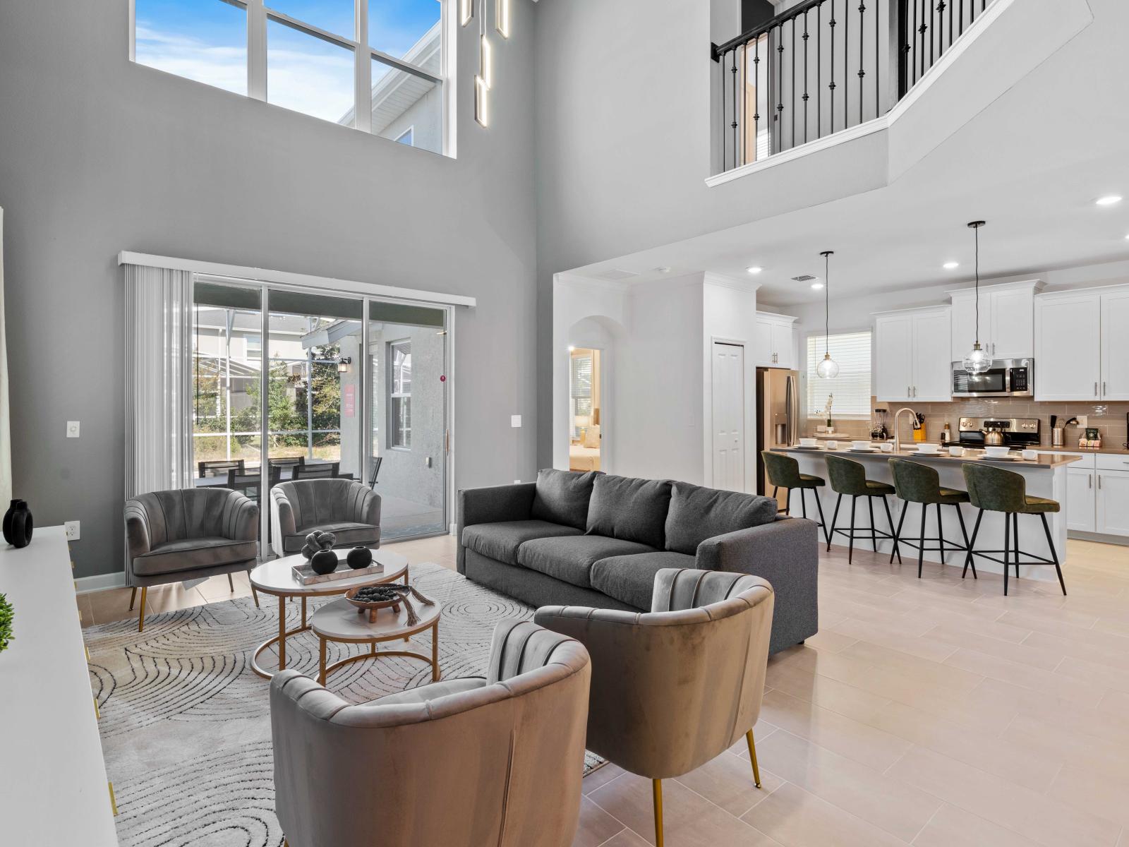 Spacious Living Area of the Home in Davenport Florida - Experience the epitome of elegance in living area - Every detail is curated for a luxurious and indulgent escape  - Smart TV and Netflix - Access to outdoors with pool and seating