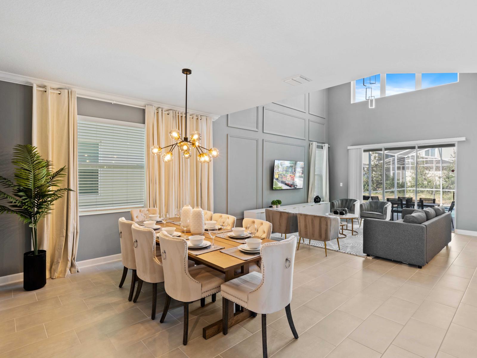 Outstanding Dining Area of the Home in Davenport Florida - Featuring a dining area beside the living space, creating an elegant and convivial setting - 8 Persons Dining - Open-concept living area seamlessly connected to a stylish living space