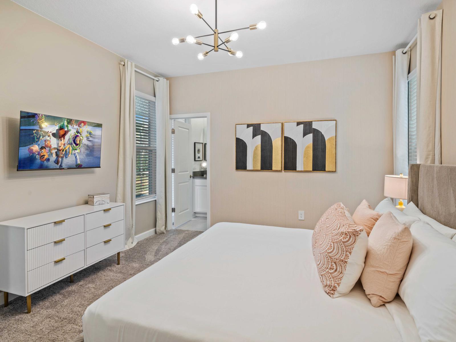 Lush Bedroom of the Home in Davenport Florida - Bright and airy bedroom with large windows for natural illumination - Thoughtfully designed bedroom featuring functional and stylish furniture - Comfy Bed, Smart TV and Netflix - Attached Bathroom