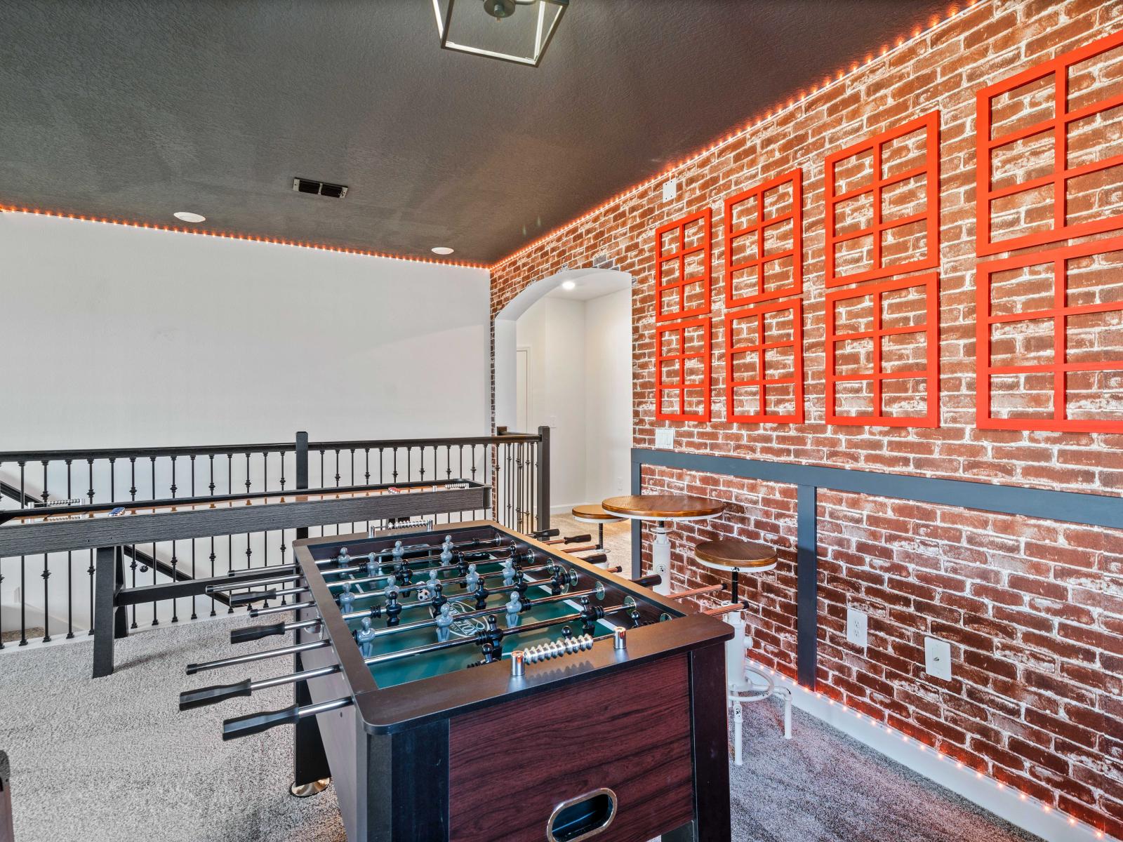 Game area with a foosball table of the Home in Davenport Florida - Perfect for improving your game or enjoying a friendly match - A hub of entertainment for all ages