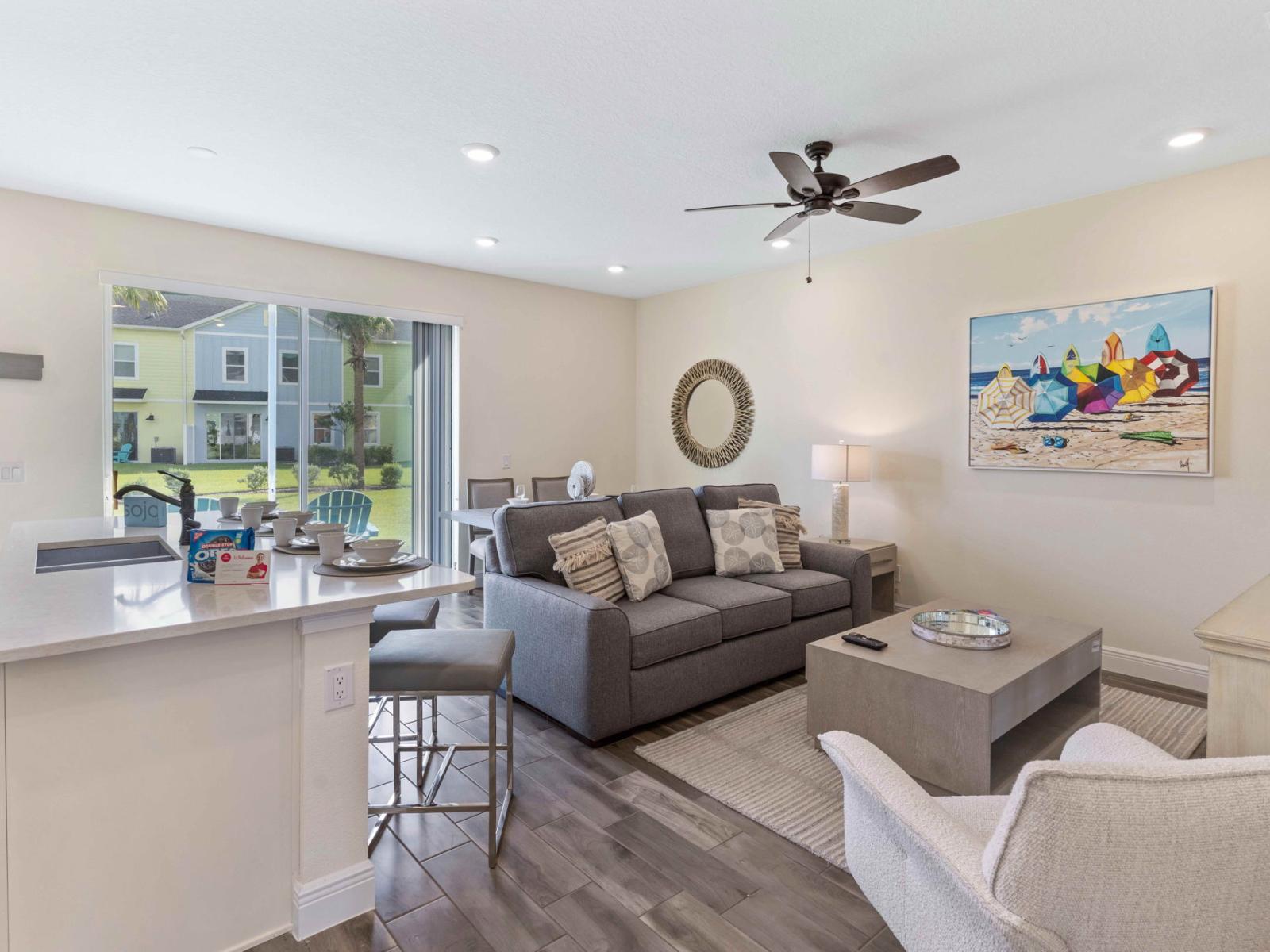 Inviting living area of the cottage in Kissimmee Florida - Natural light floods the room, enhancing its warmth and inviting atmosphere - Smart TV and Netflix - Thoughtful mix of textures, from plush rugs to tasteful throw pillows