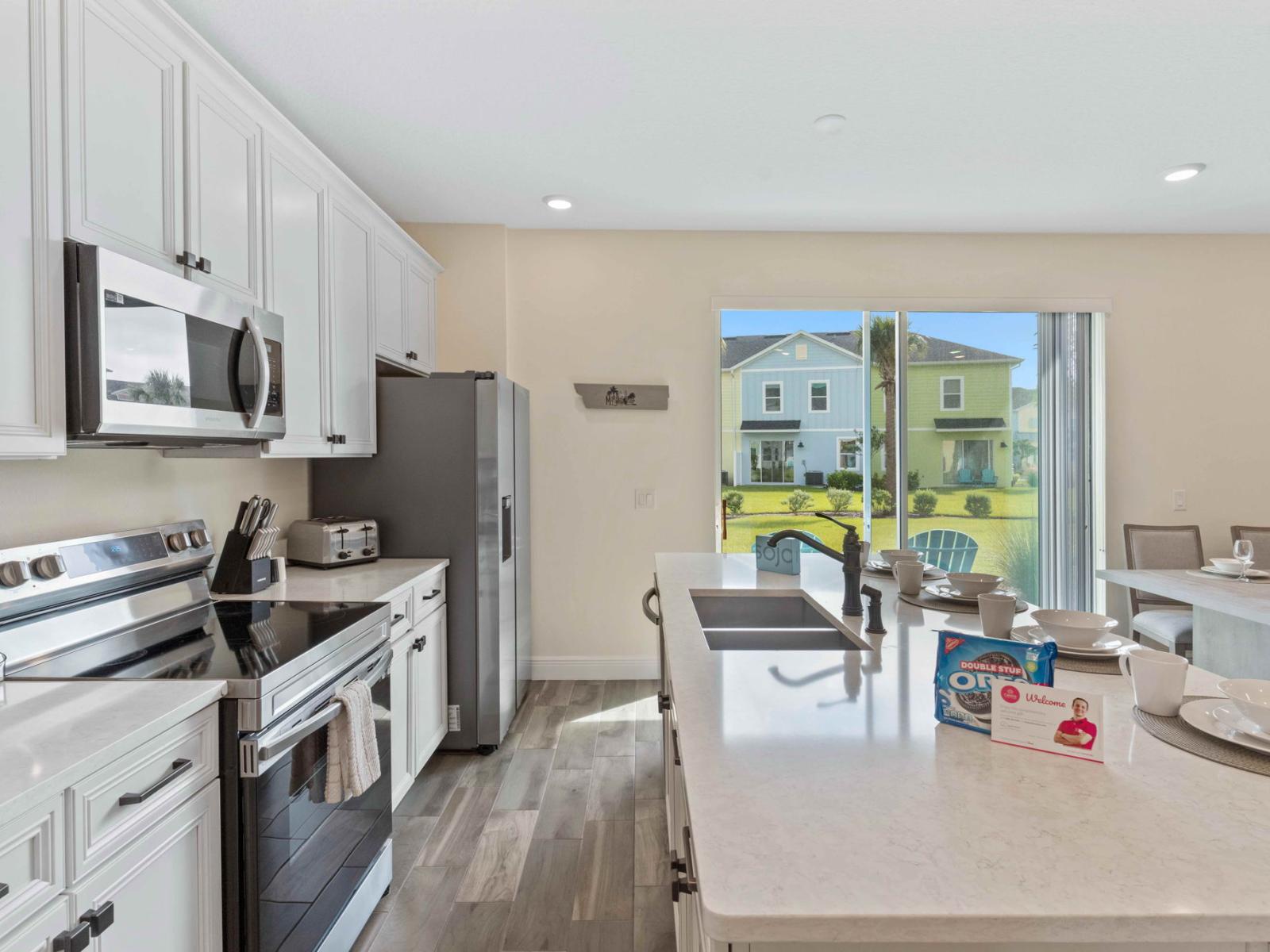 Polished kitchen of the cottage in Kissimmee Florida - With sleek appliances, ample counter space, and a chic dining set - Designed for both culinary creativity and elegant dining experiences