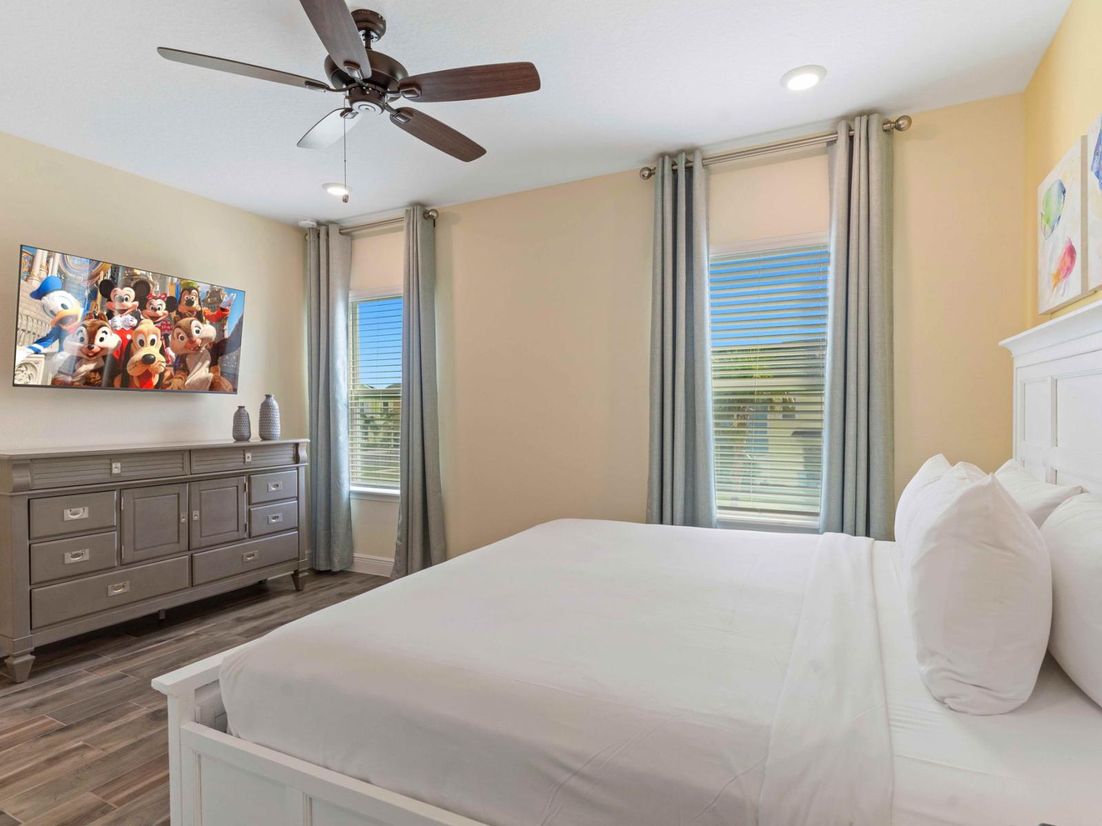 Alluring bedroom of the cottage in Kissimmee Florida - Smart TV and Netflix - Modern bedroom with sleek design and plenty of natural light - Plush double bed - Harmonious color palette creating a soothing atmosphere