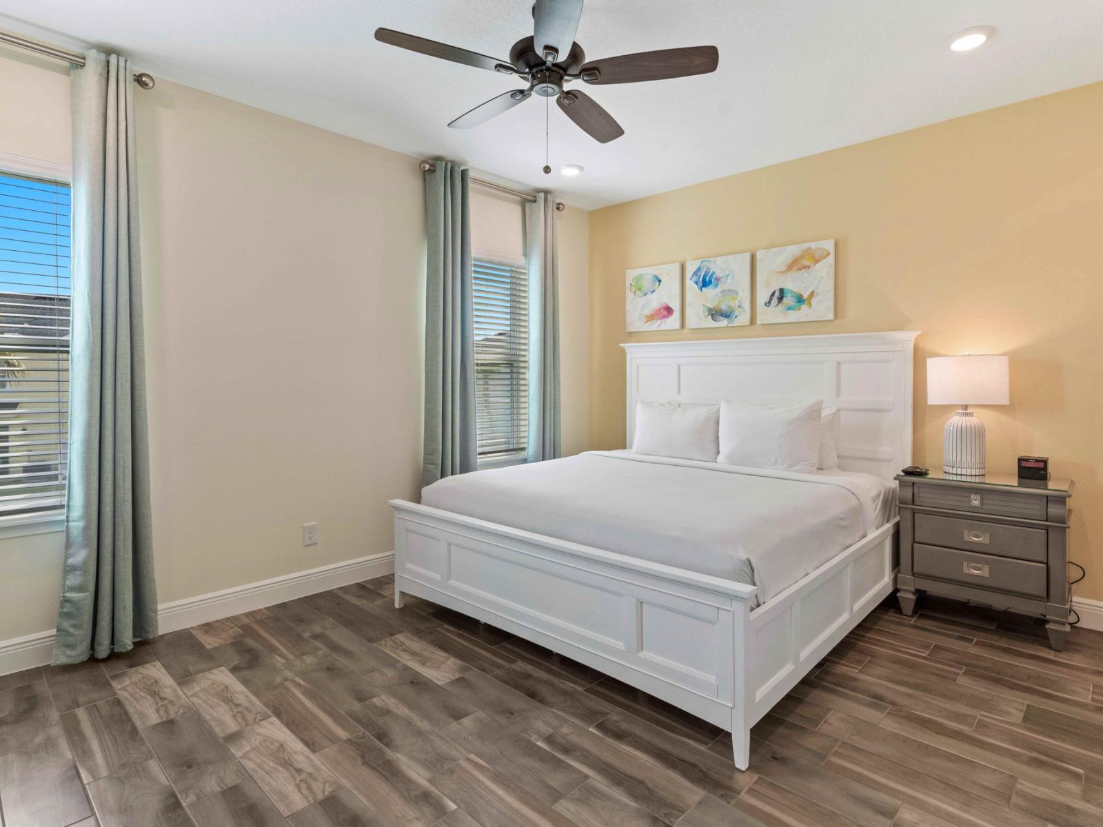 Spacious bedroom of the cottage in Kissimmee Florida - Comfy double bed - Attached bathroom for privacy and convenience - Minimalist decor, creating a clean and uncluttered sleeping space